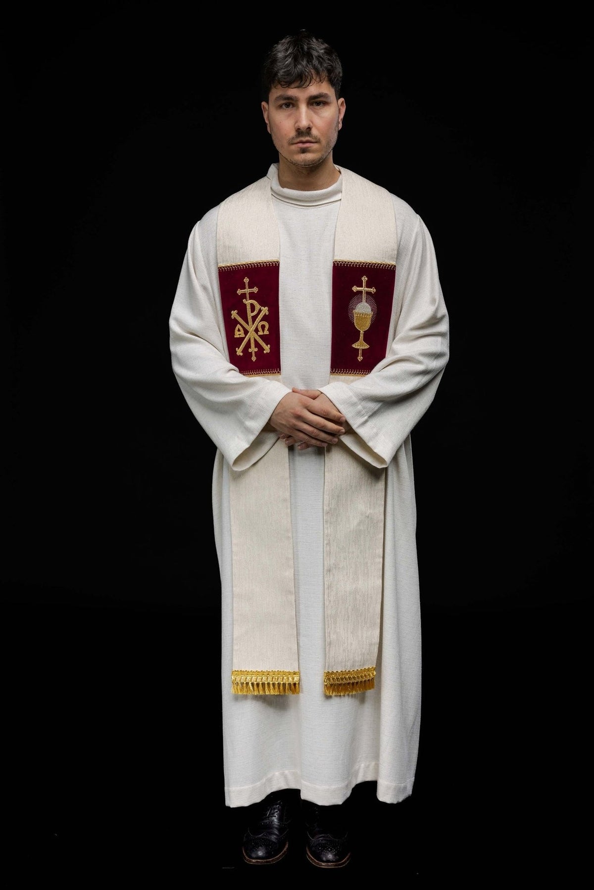Stole front view worn, with burgundy panels, PAX and communion chalice embroidery