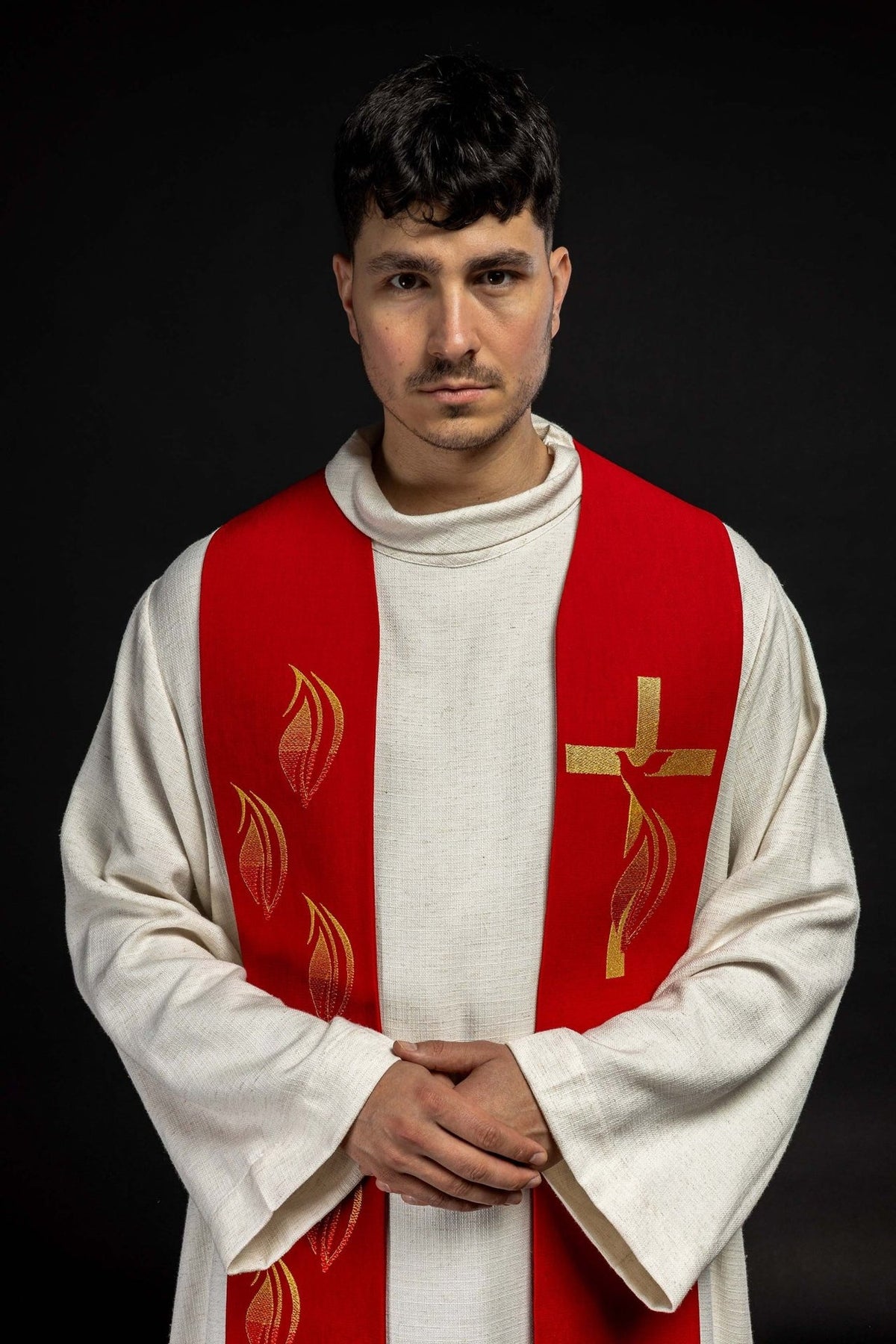 Red embroidered stole front close-up with Holy Spirit, cross and tongues of fire