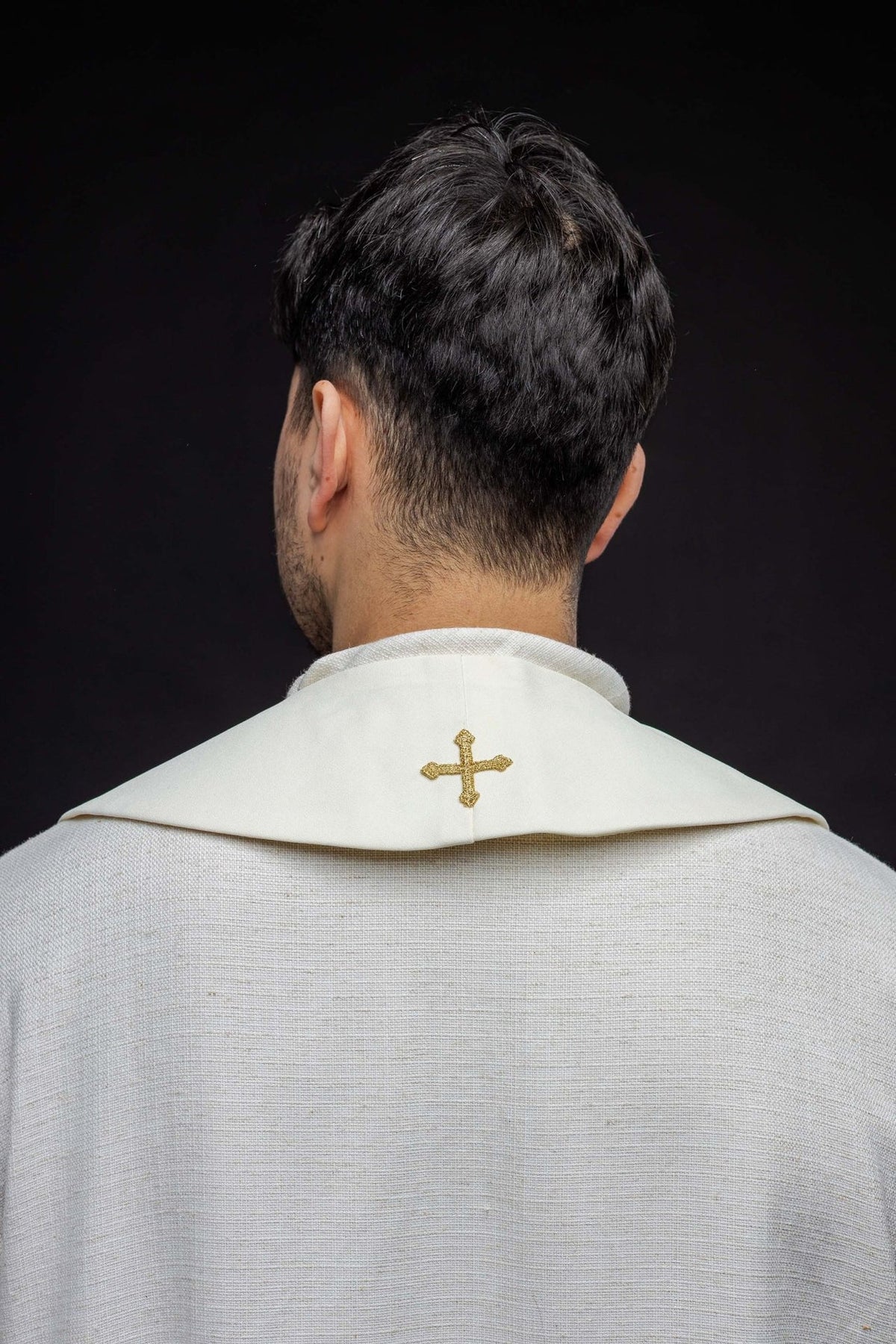 Embroidered stole back view showing a small gold cross at the neck