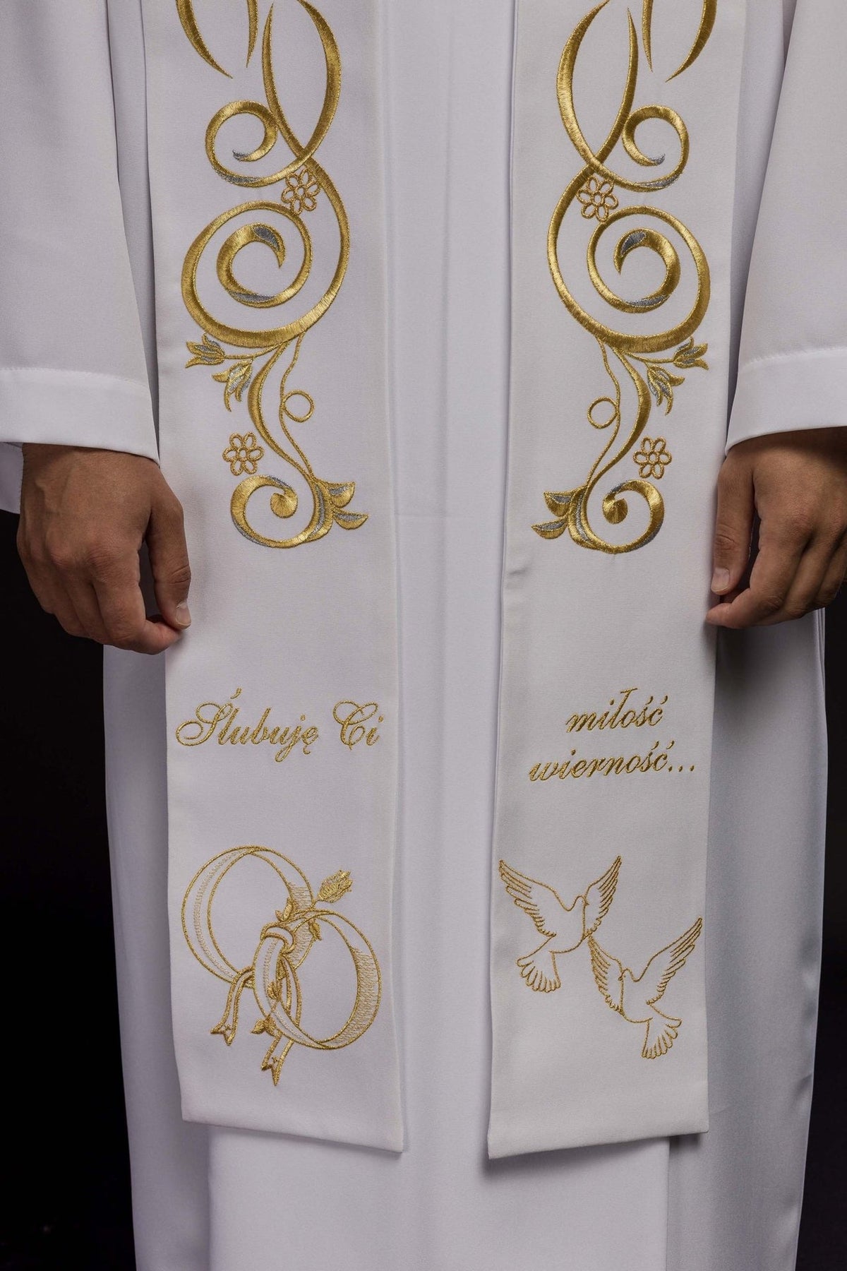 White wedding stole close-up showing gold scroll and floral embroidery