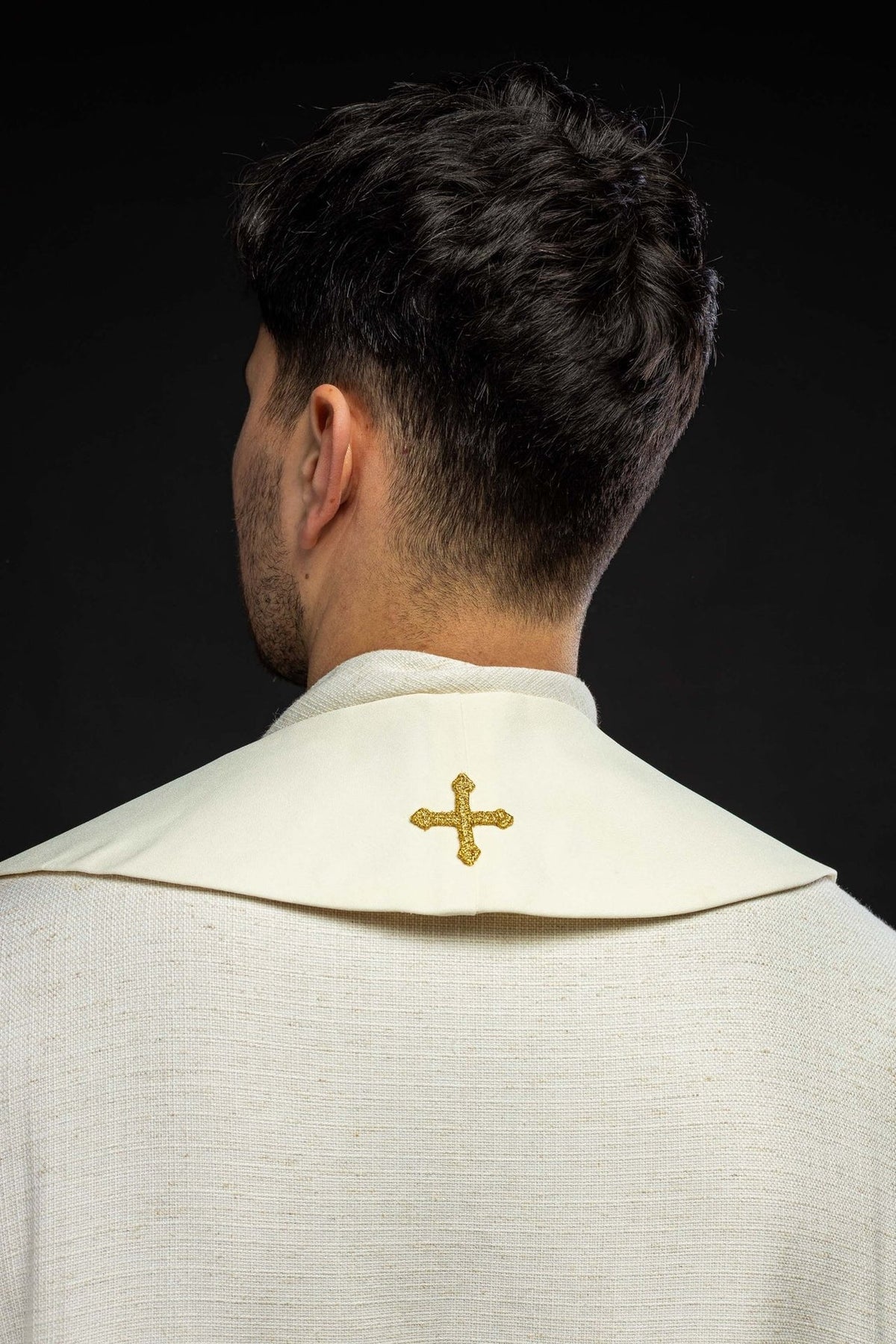 Wedding stole worn from the back, showing a small gold embroidered cross at the neck