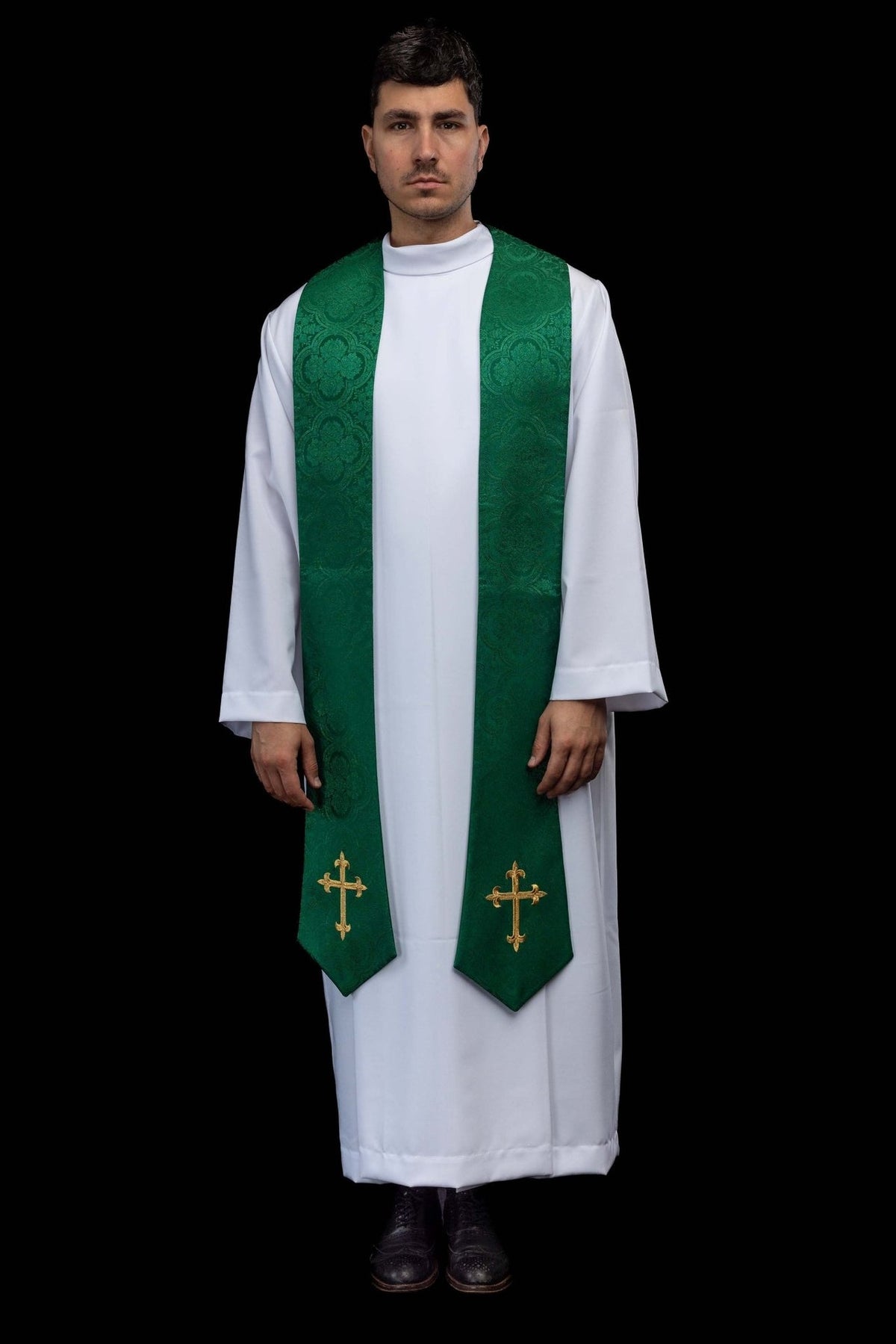 Green embroidered stole worn over an alb, full front view with gold crosses