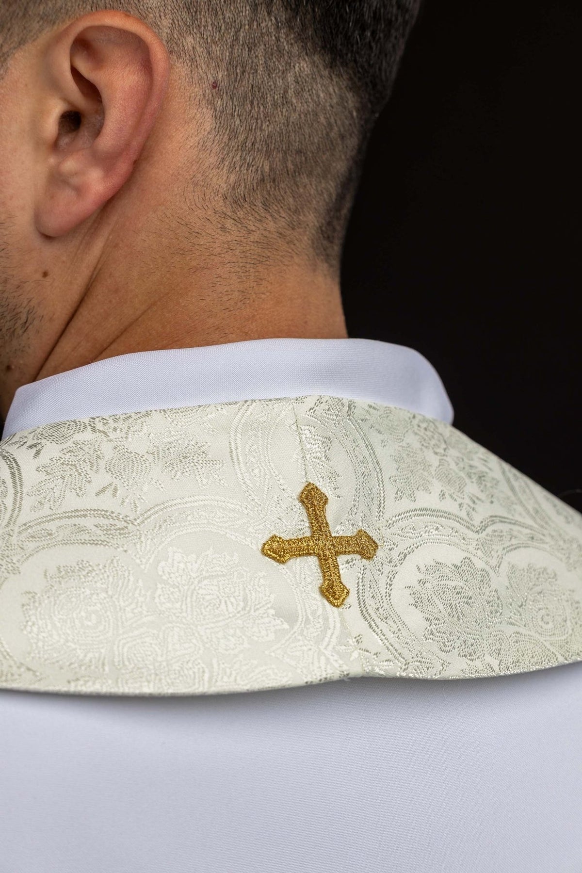 Ecru stole back view with gold cross embroidery and jacquard pattern