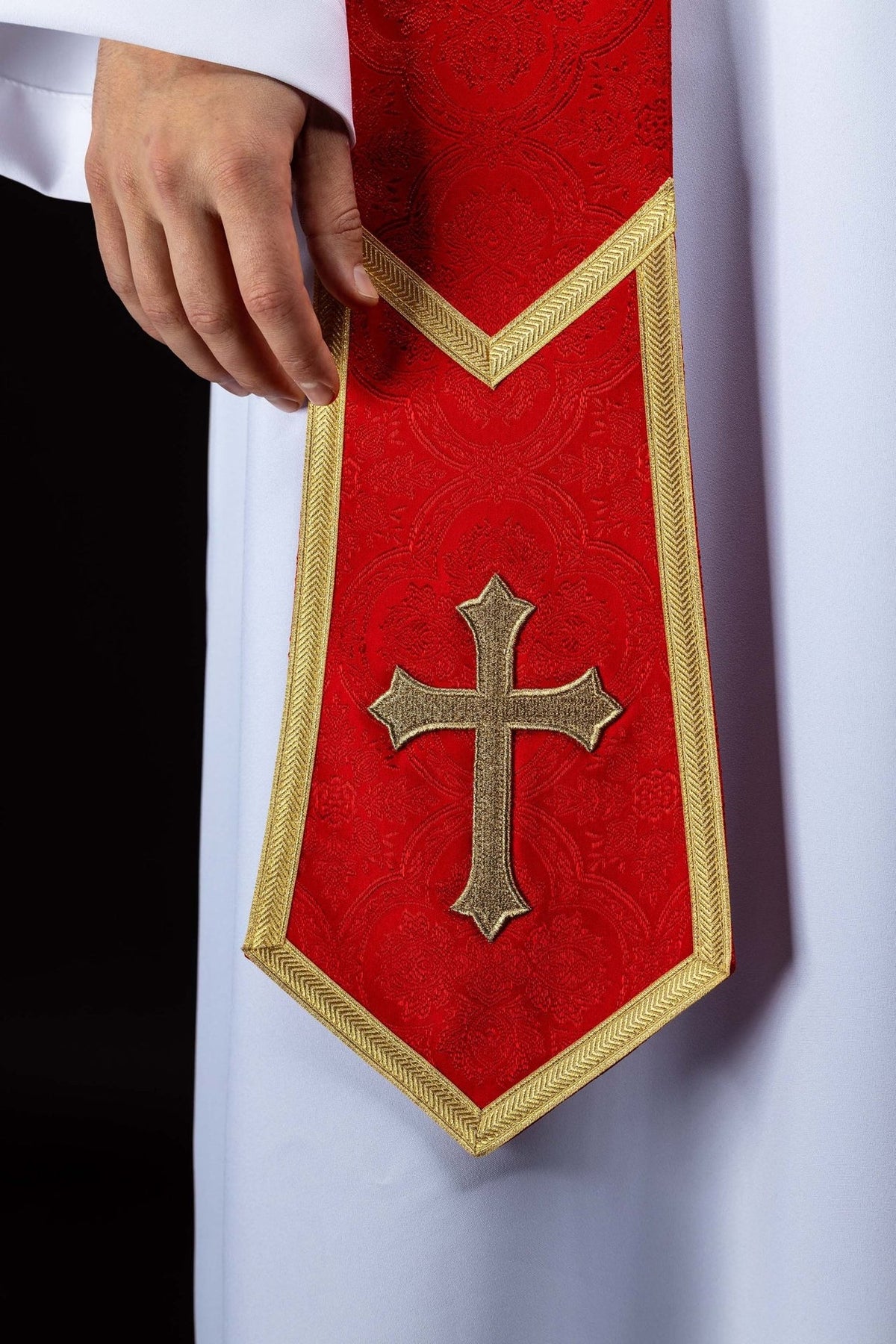 Red priest stole close-up with gold cross embroidery and gold trim
