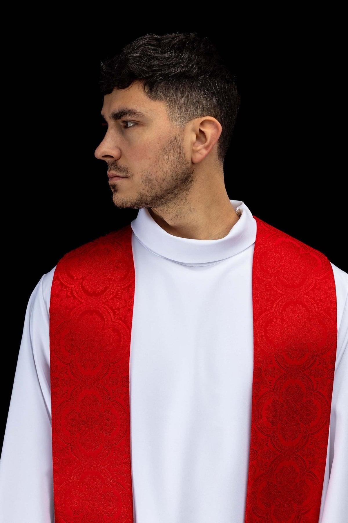 Red stole worn close-up showing jacquard fabric pattern