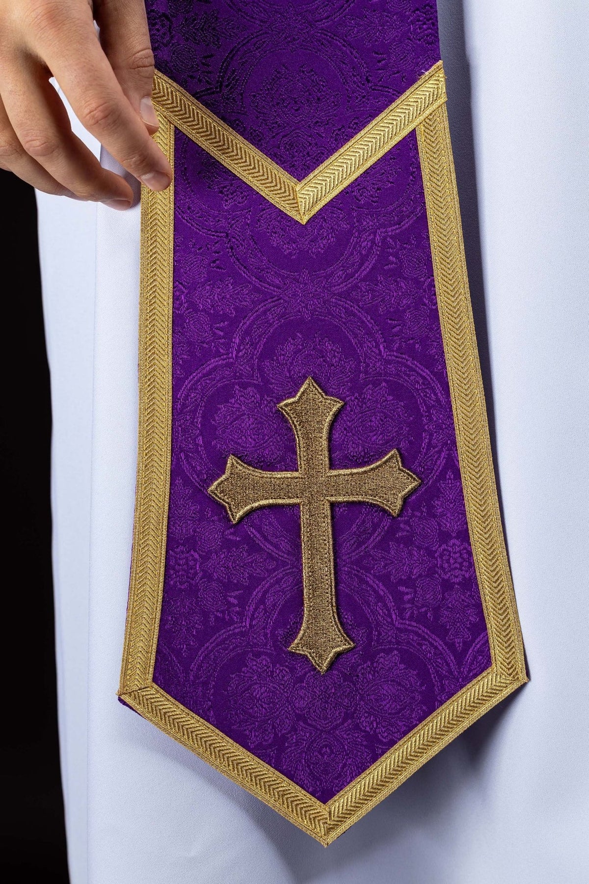 Purple priest stole close-up with gold cross embroidery and gold trim
