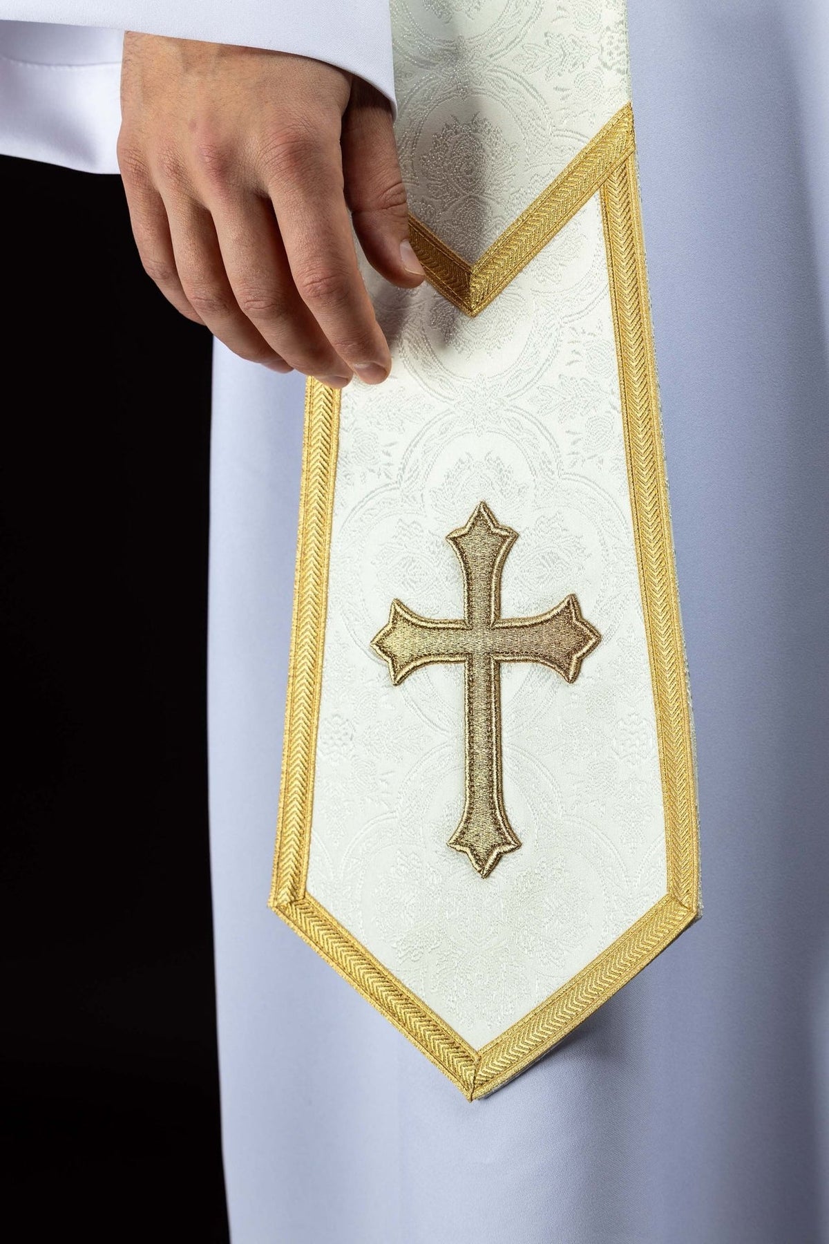 Ecru priest stole close-up with gold embroidered cross