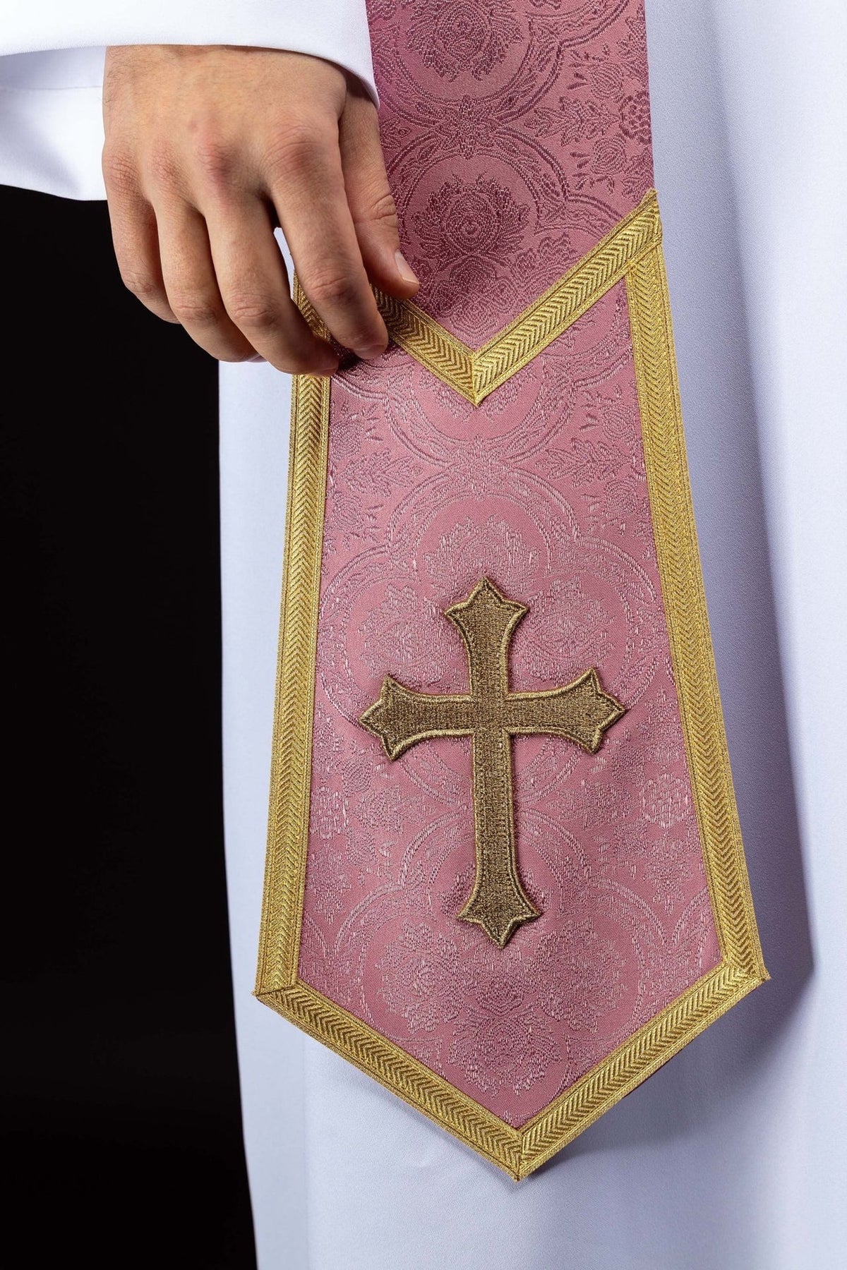 Rose stole close-up showing gold cross and pointed gold edging