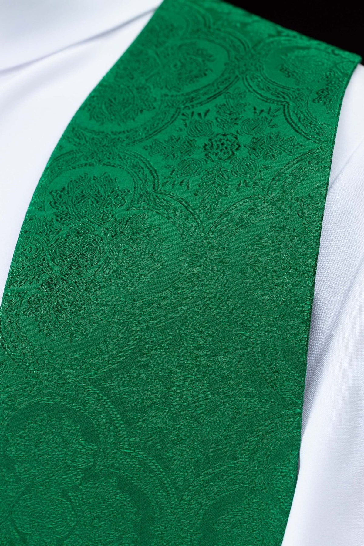 Green stole close-up showing green jacquard fabric pattern