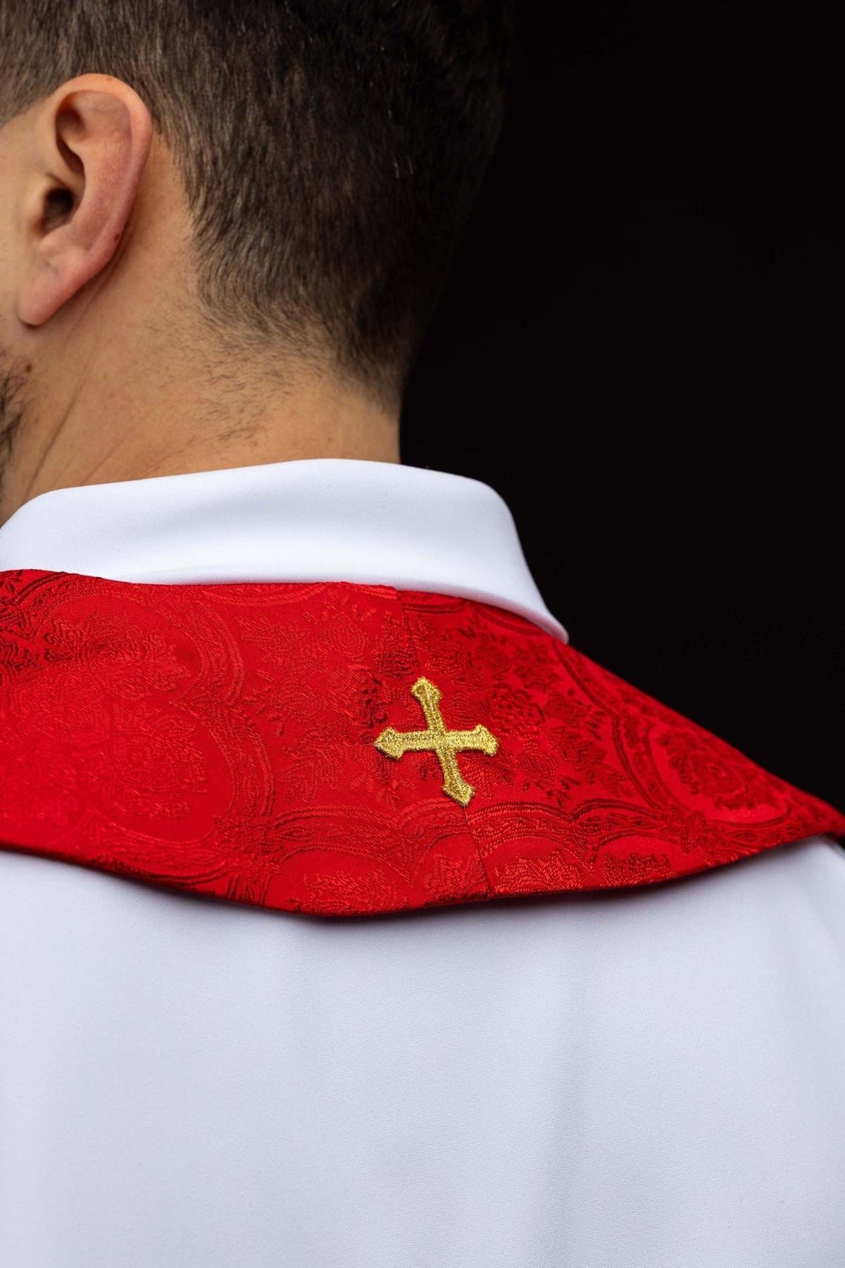 Red stole back view with small gold cross embroidery