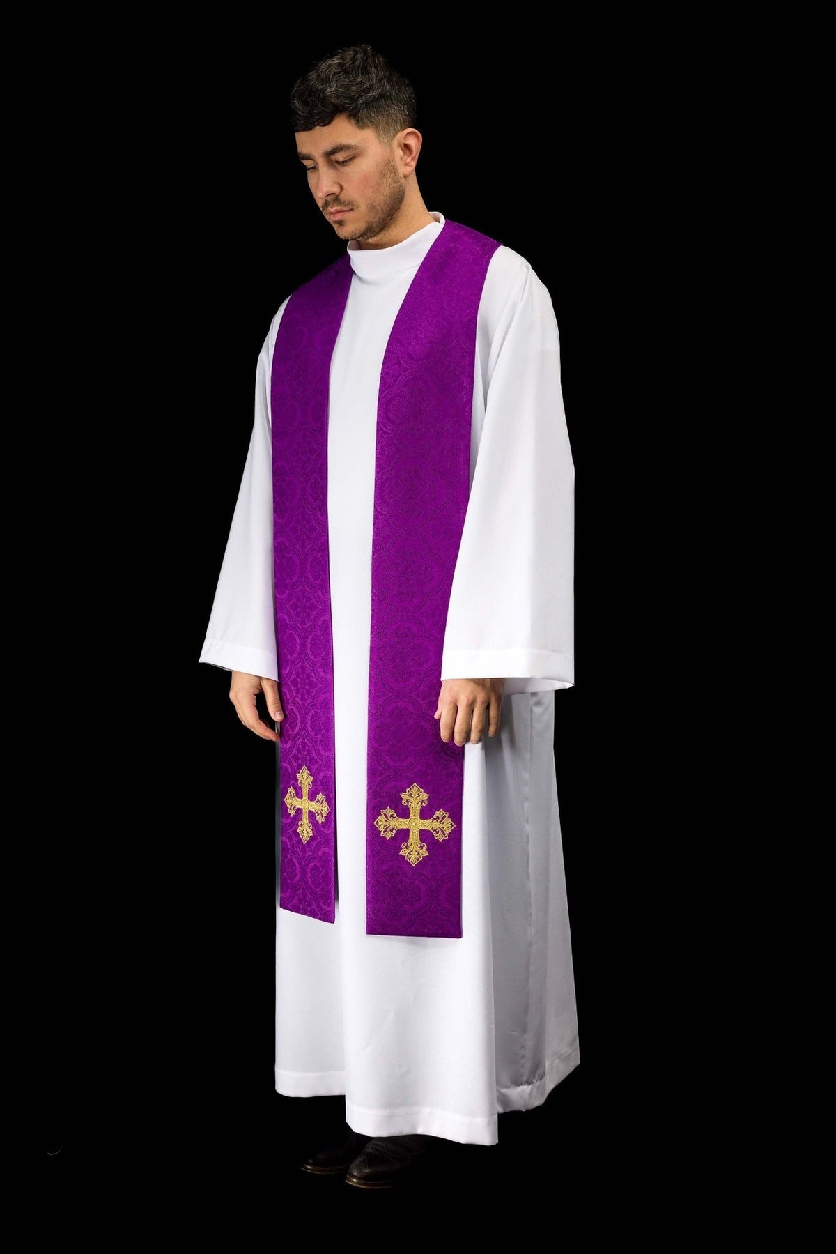 Purple stole three-quarter view worn over an alb