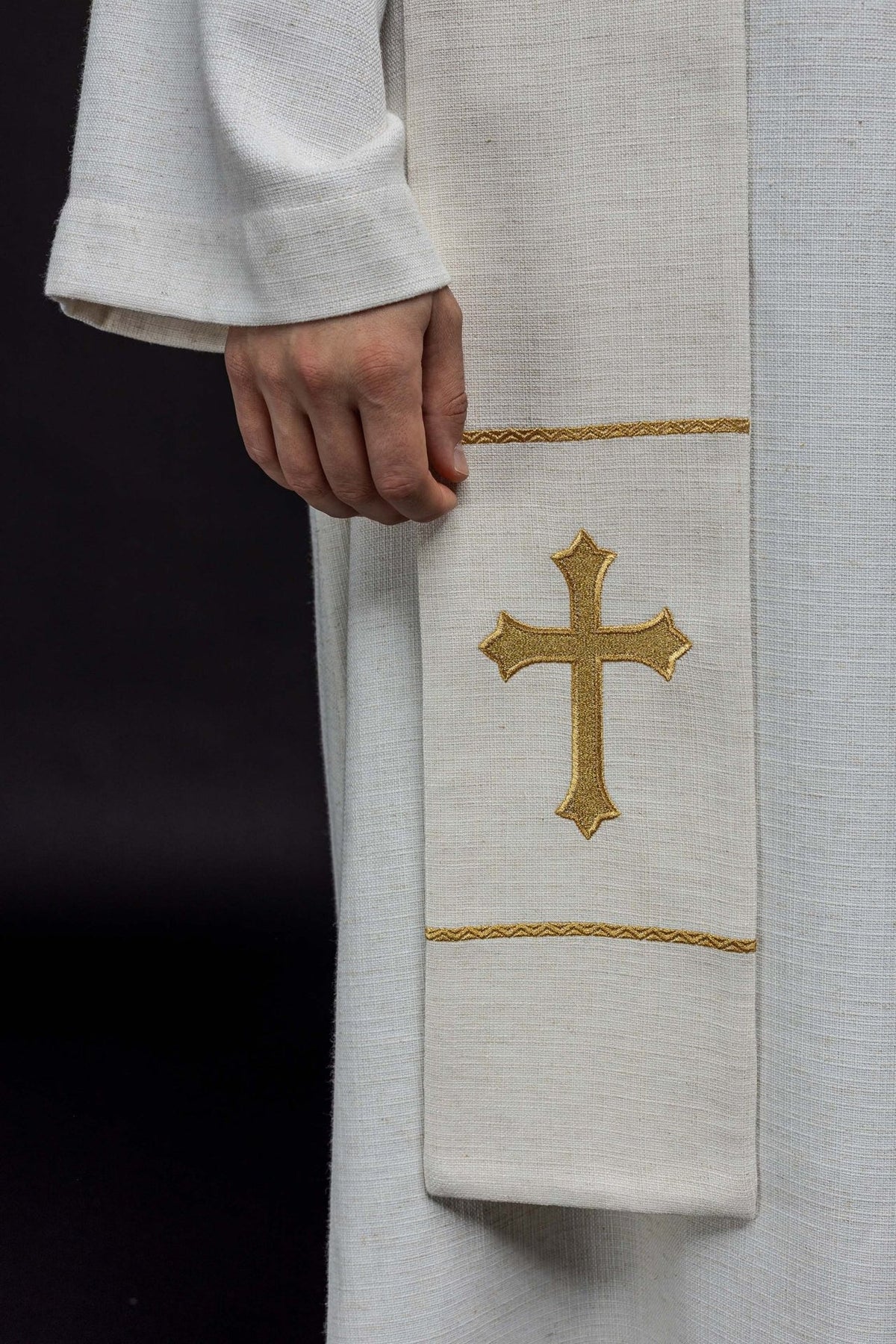Padre Pio stole close-up showing a gold embroidered cross and trim