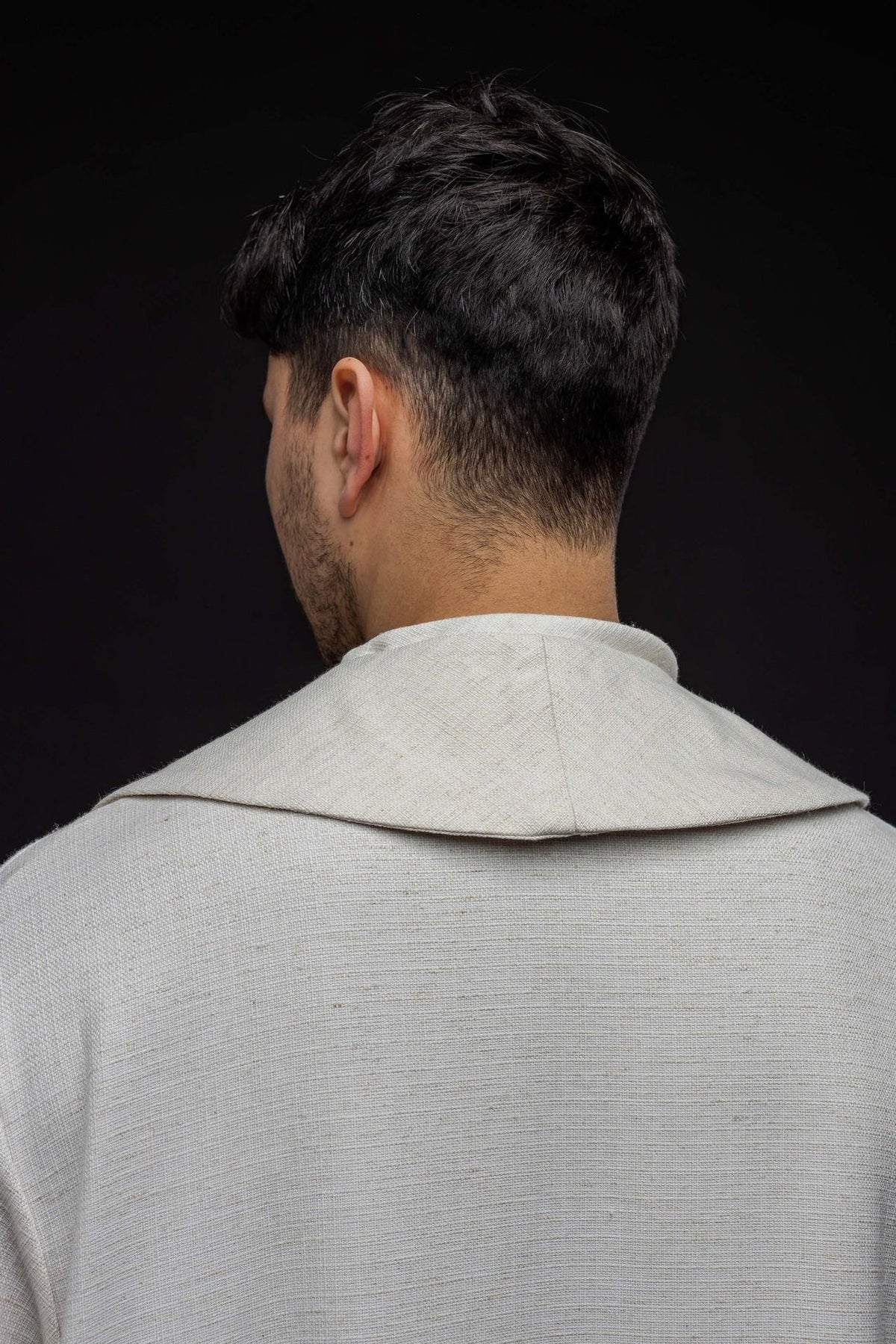 White stole back view showing the plain fabric and shoulder shape