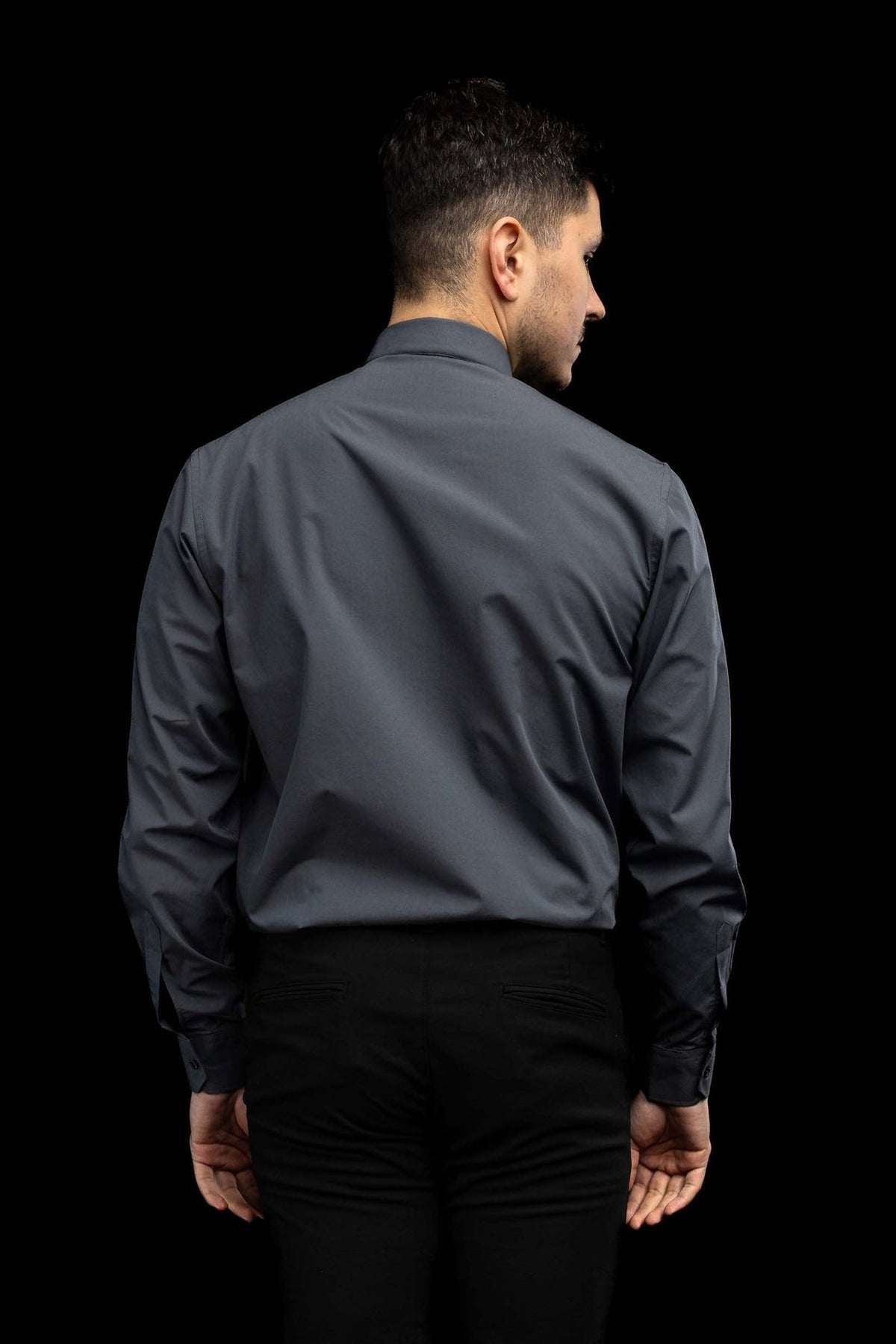 Clerical collar and shoulder seam on the dark gray clergy shirt