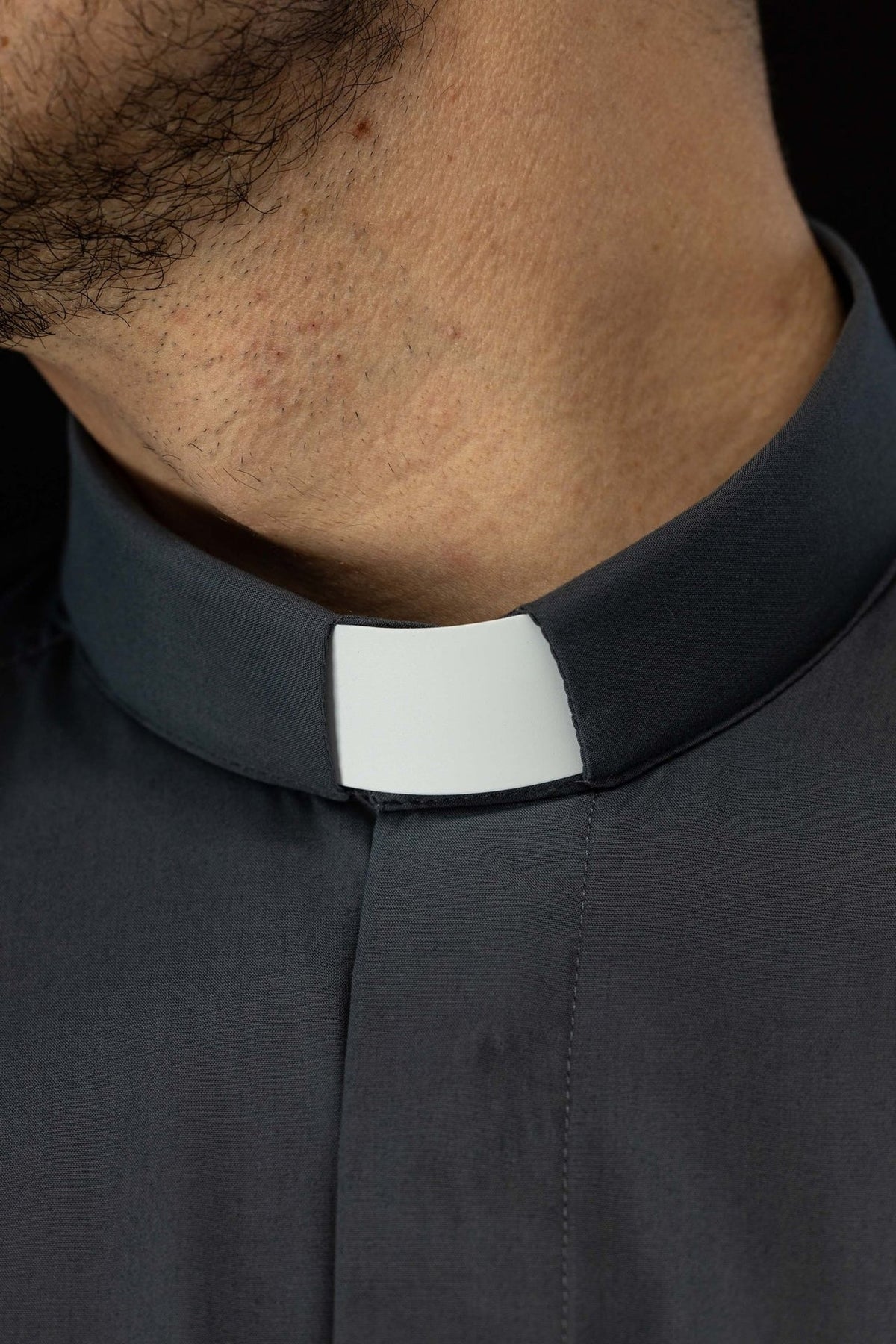 Clergy shirt close-up of dark gray clerical collar with white insert