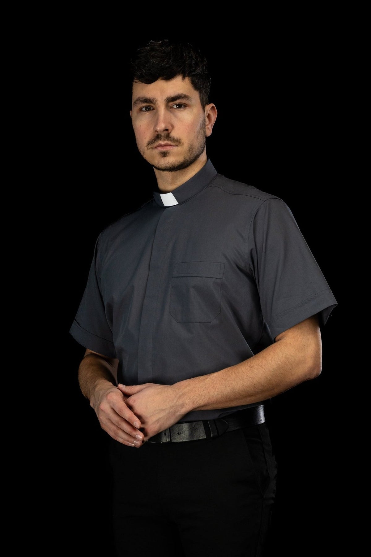 Dark gray clergy shirt three-quarter view with short sleeves
