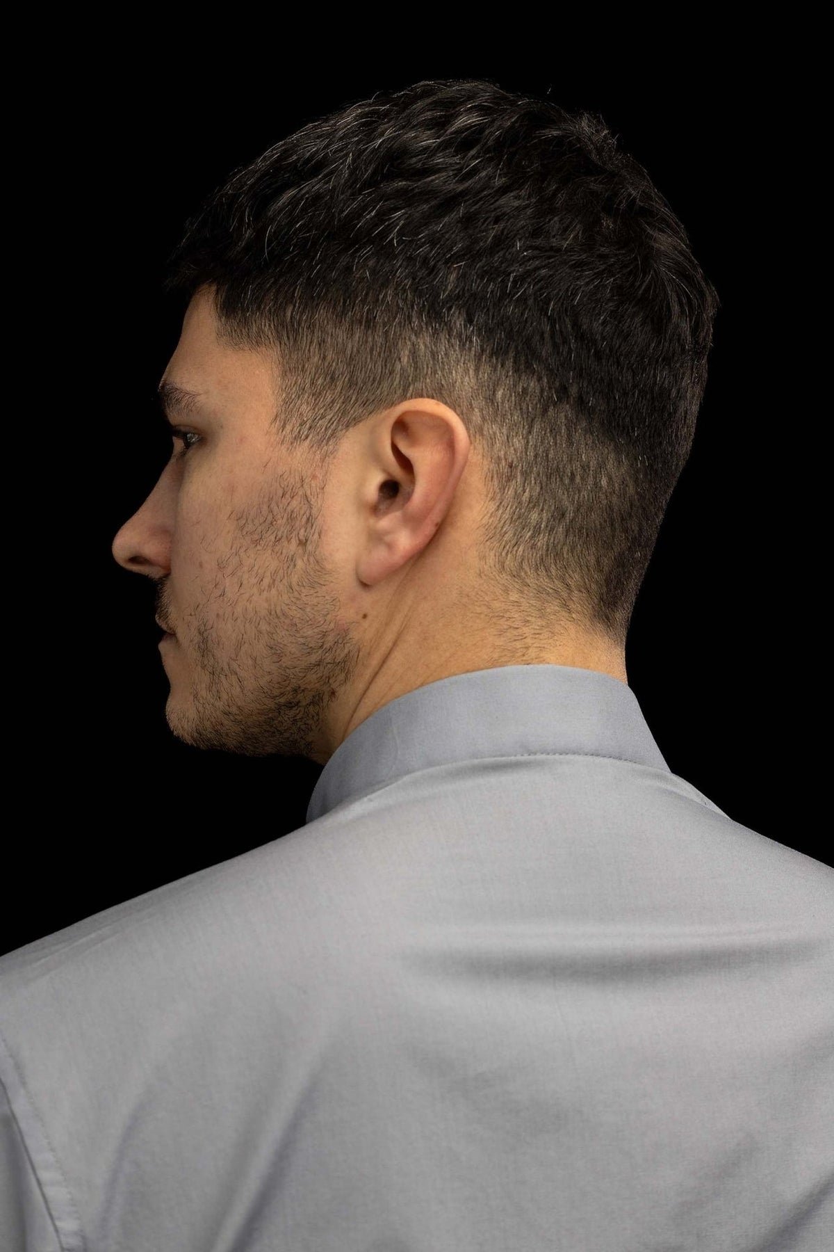 Light gray clergy shirt worn, side and back collar view