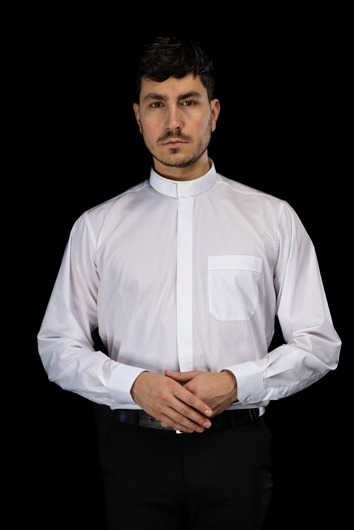 White clergy shirt front view showing the long sleeves and clerical collar