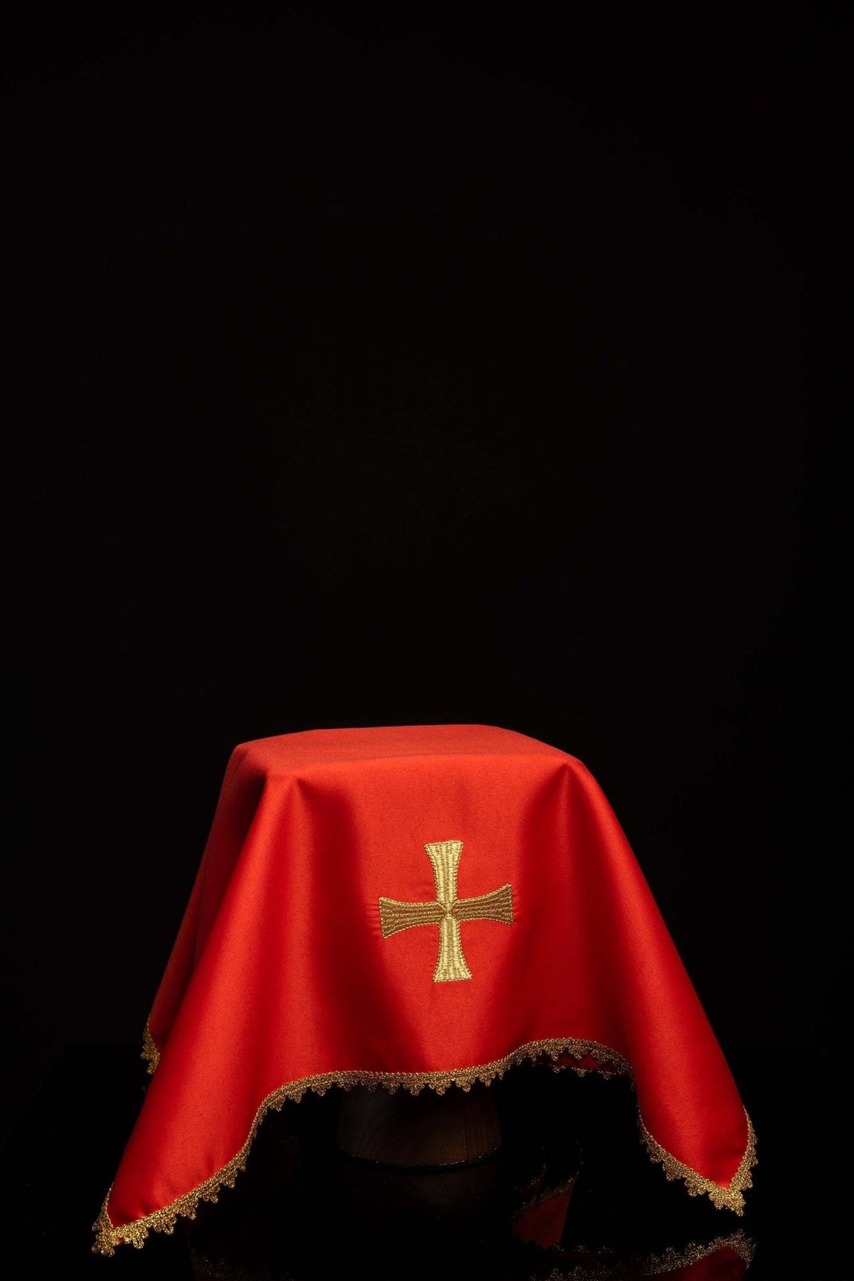 Red chalice veil with embroidered gold cross and gold trim, front view