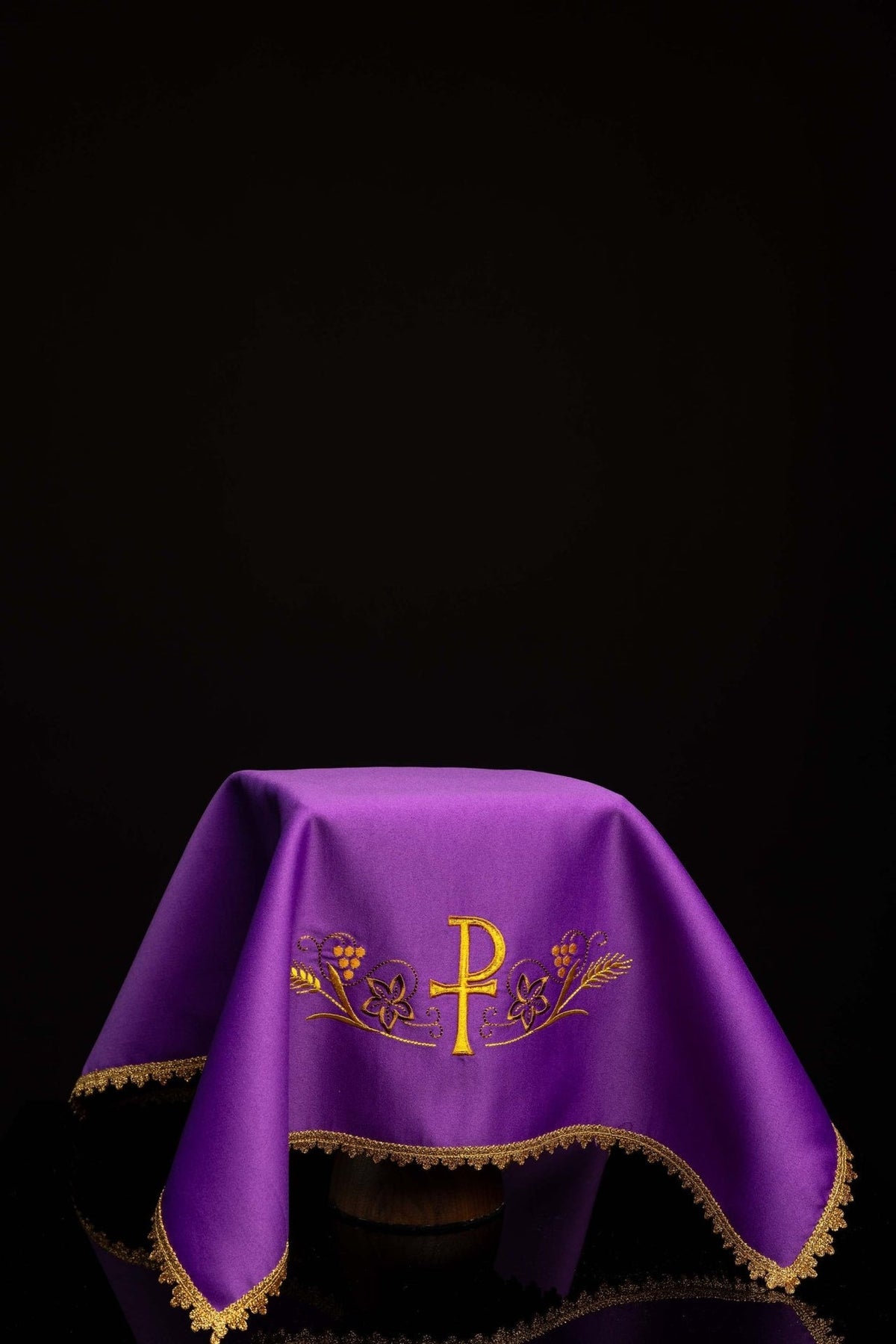 Purple chalice veil with PAX embroidery and gold trim, draped view
