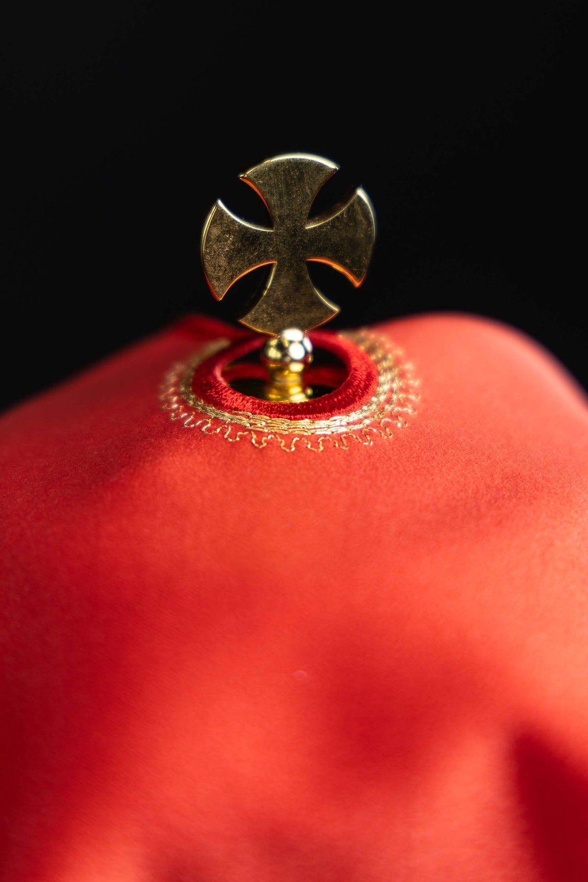 Ciborium veil close-up showing top cross ornament and gold trim
