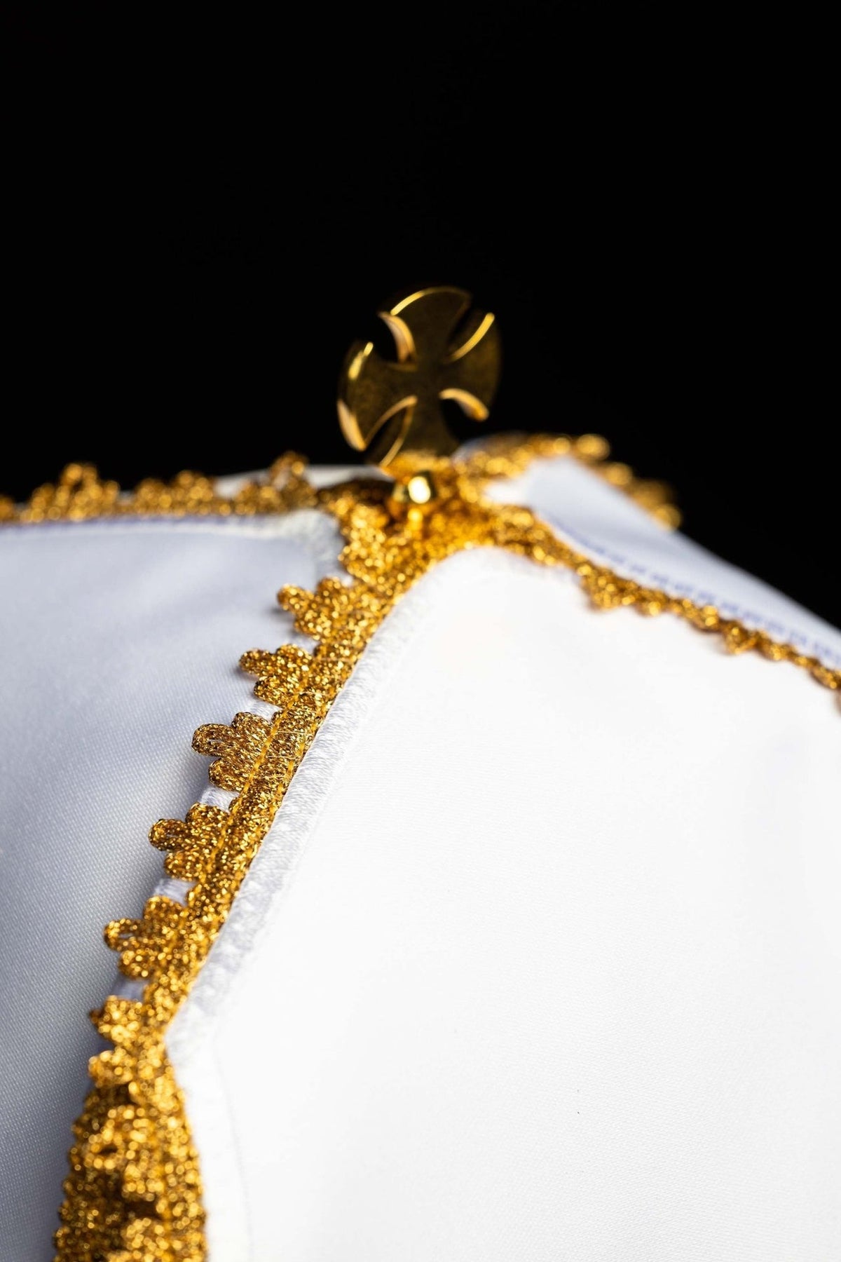 Ciborium veil top detail with gold cross fitting and ornate gold trim