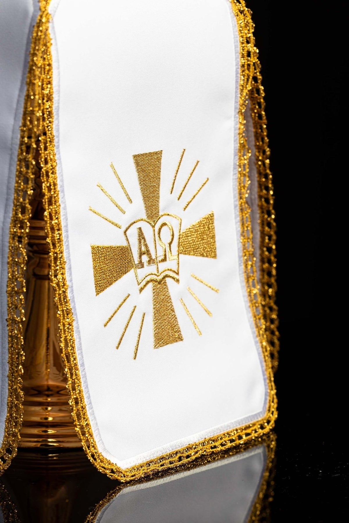 Ciborium veil close-up showing gold Alpha Omega embroidery and ornate gold trim