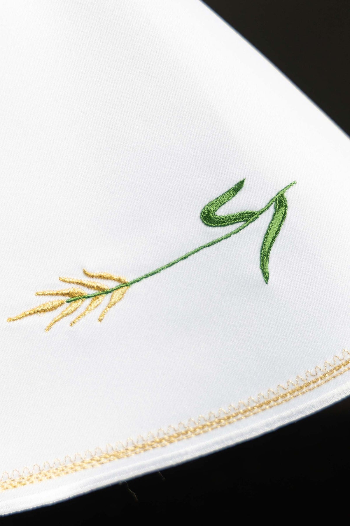 Ciborium veil close-up showing green and gold wheat embroidery with gold edging