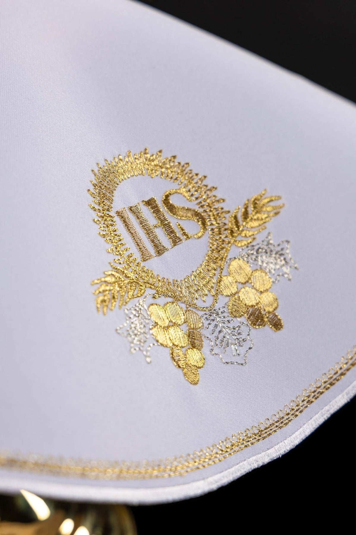 Ciborium veil close-up showing gold IHS, wheat and grapes embroidery