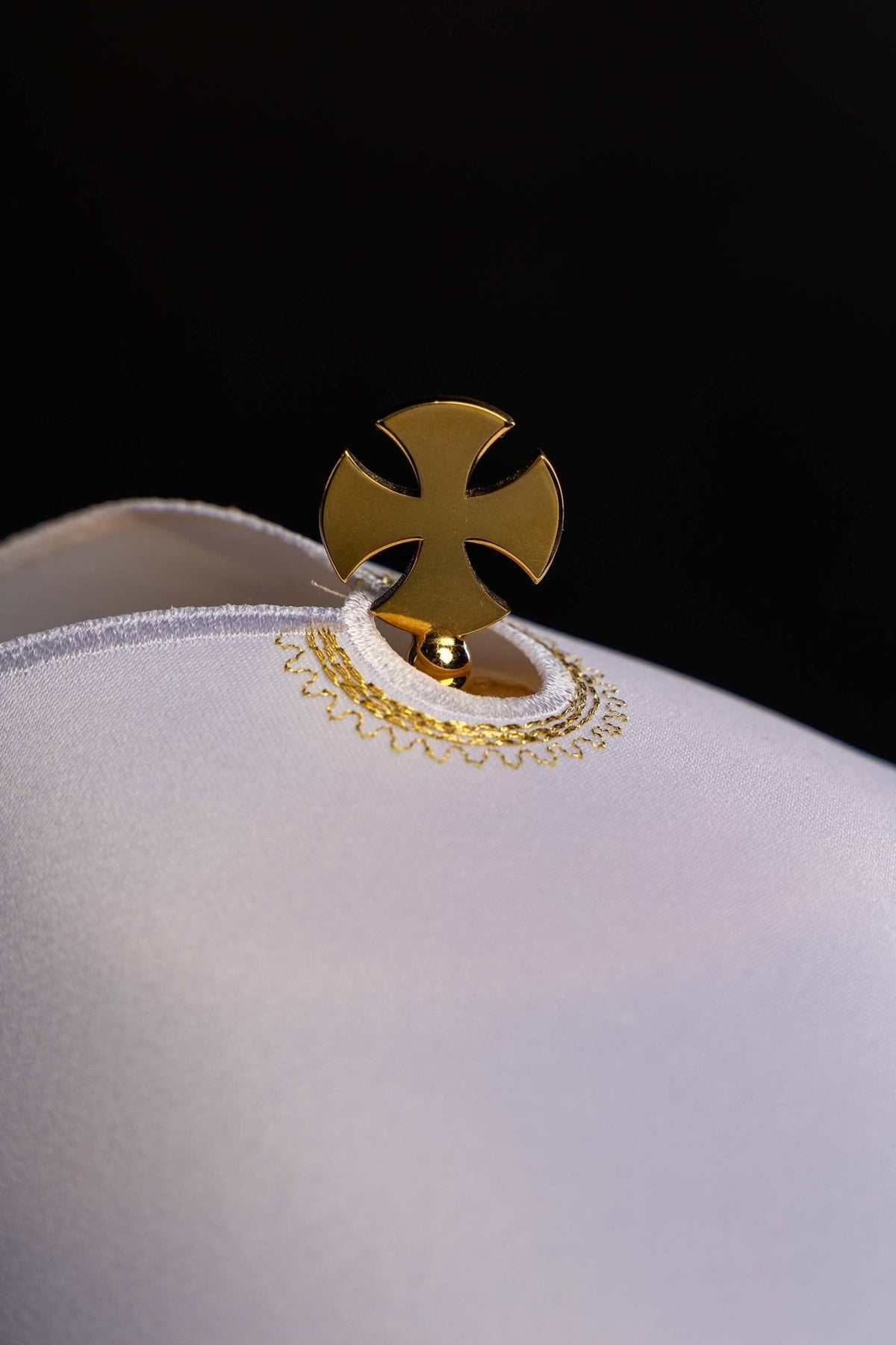 Ciborium veil close-up showing gold embroidered cross opening