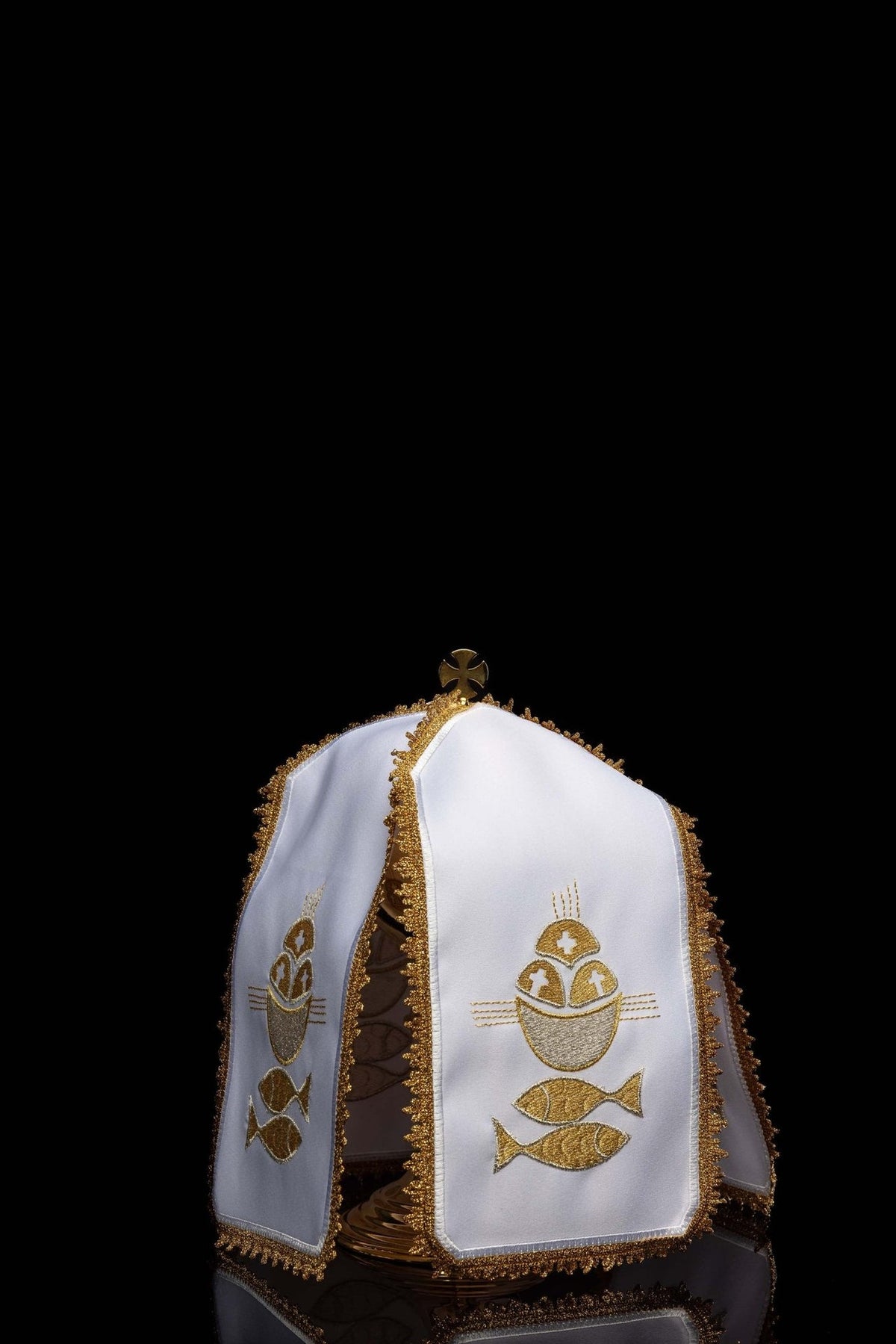 White ciborium veil, angled view showing gold embroidery on multiple panels