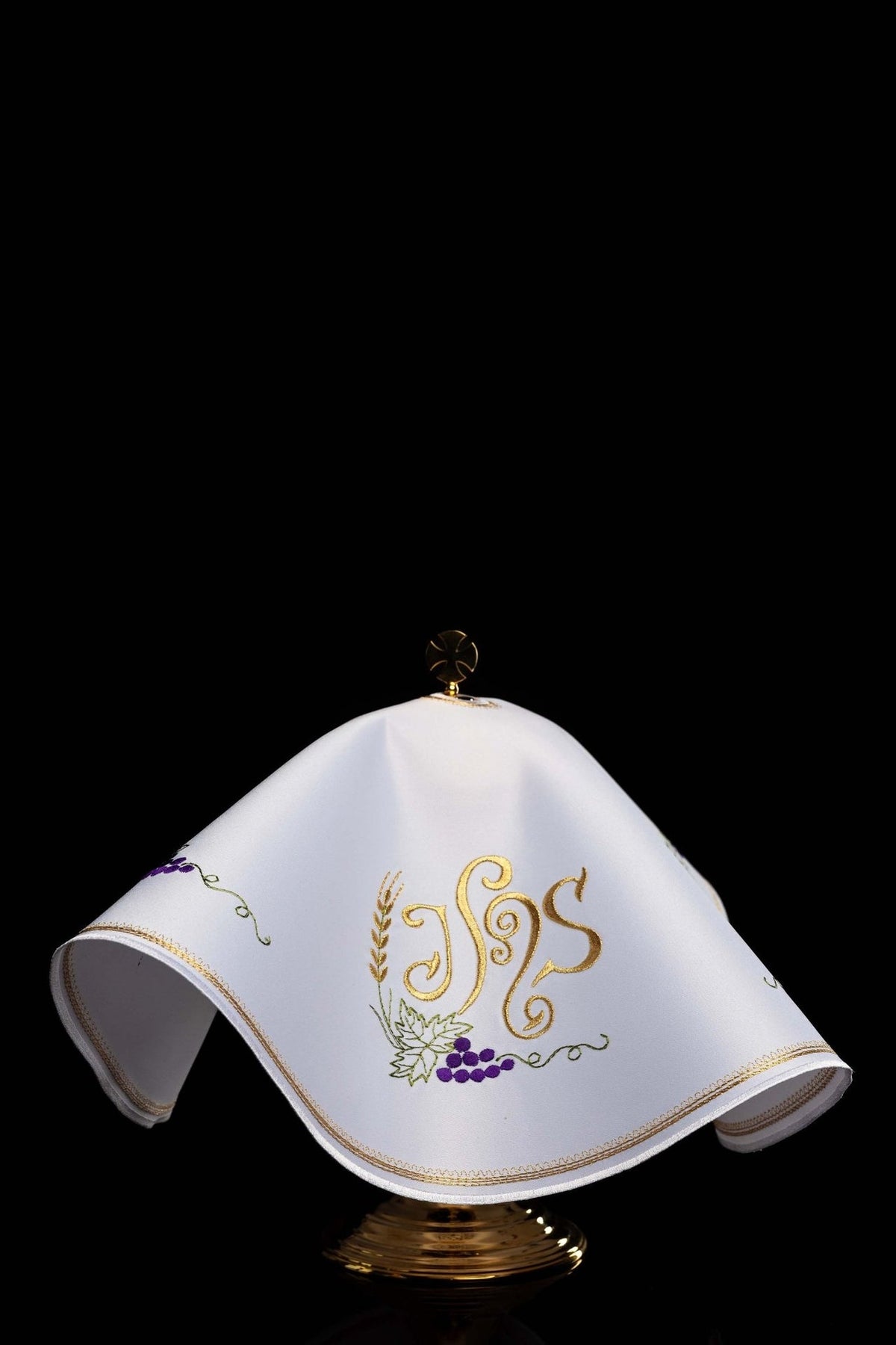 Ciborium veil front view showing white fabric, gold IHS embroidery and purple grapes