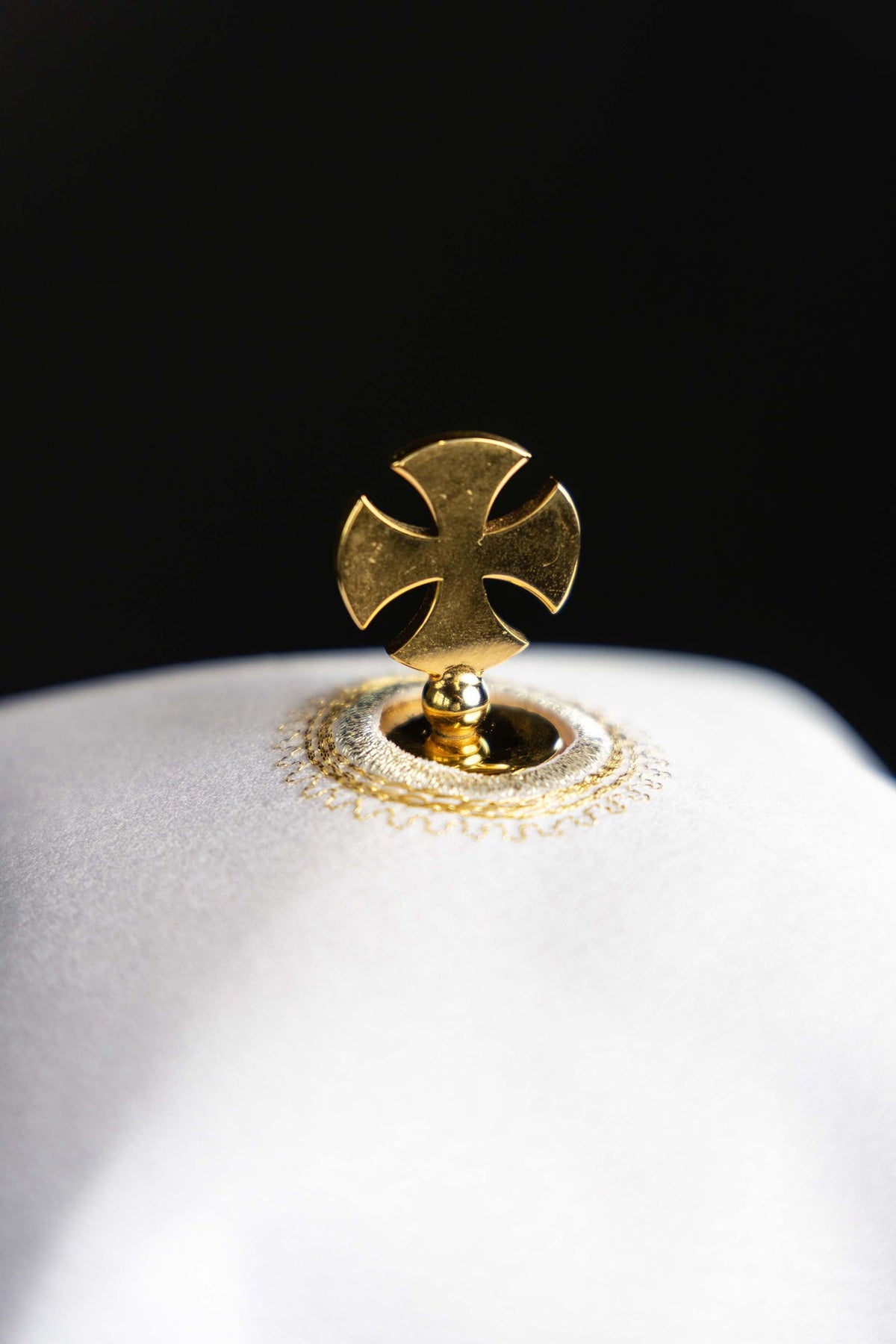 Ciborium veil close-up of gold cross finial and embroidered attachment