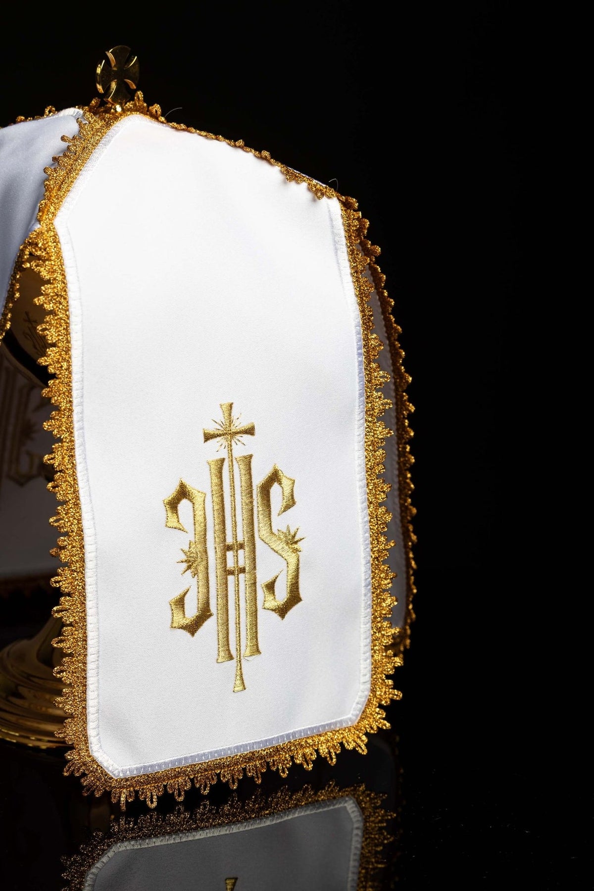 Ciborium veil front view showing white fabric, gold IHS monogram embroidery and gold fringe