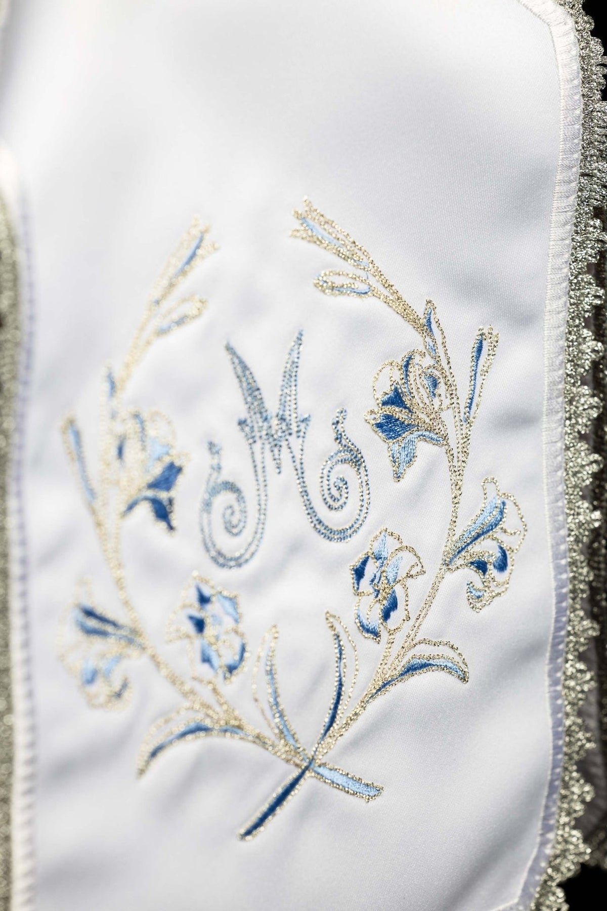 White ciborium veil detail of blue and silver Marian embroidery