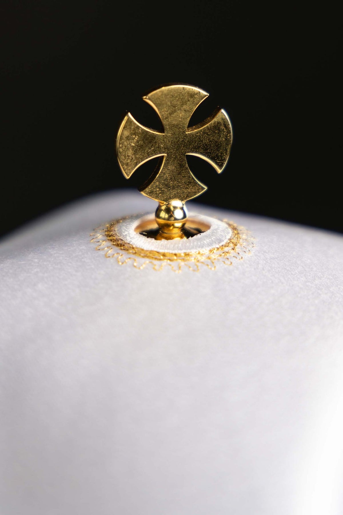 Ciborium veil close-up of gold cross finial and embroidered mount