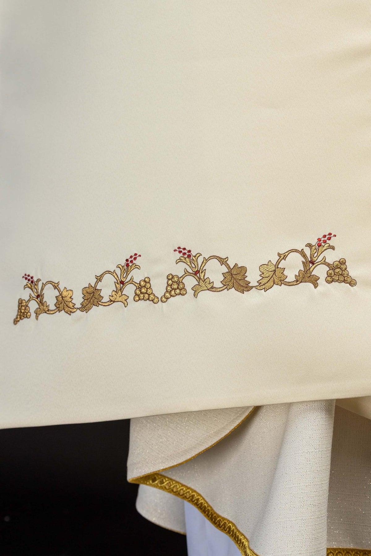 Humeral veil detail with gold embroidered vine, grapes and ecru fabric