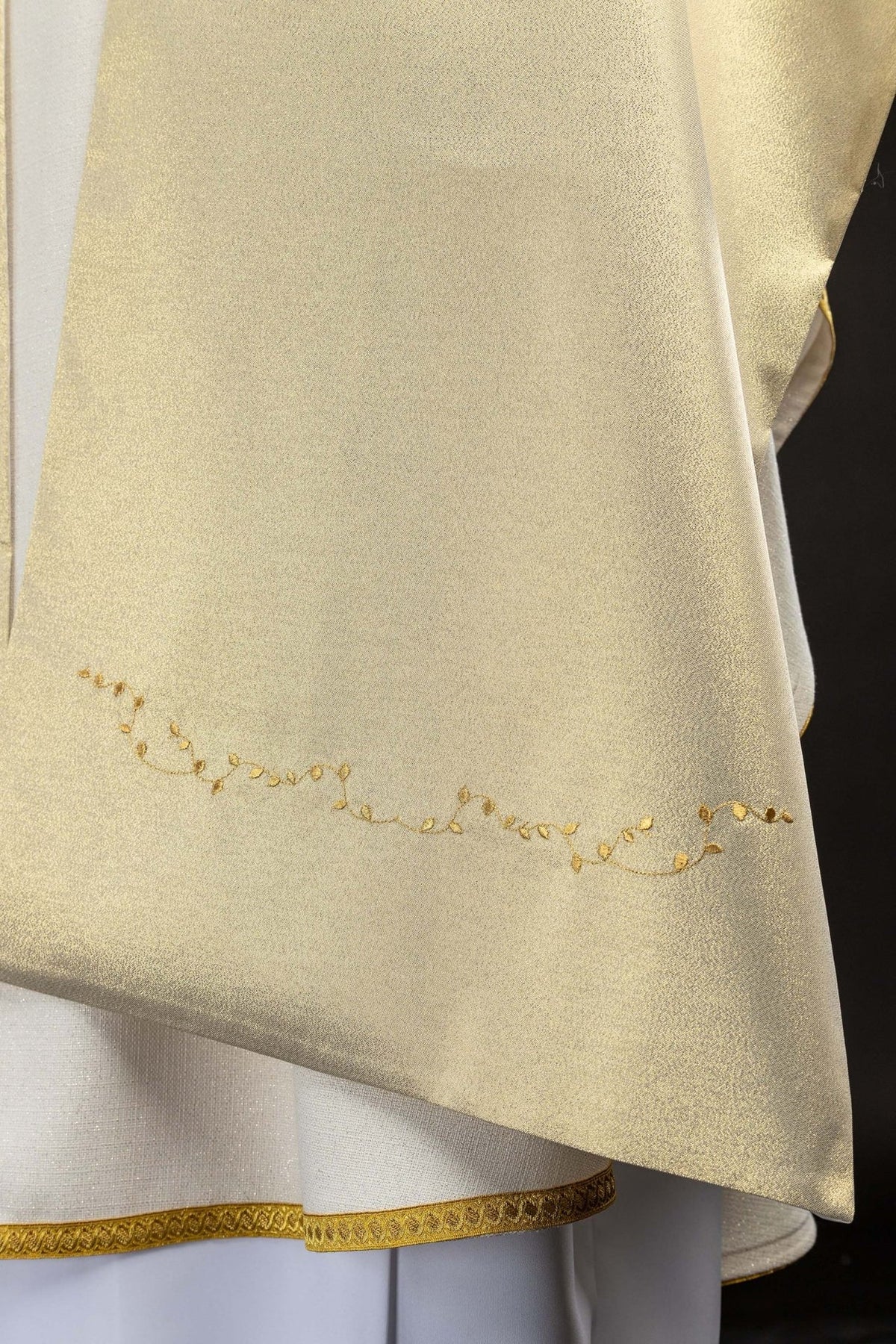 Gold humeral veil close-up showing leafy embroidered border detail