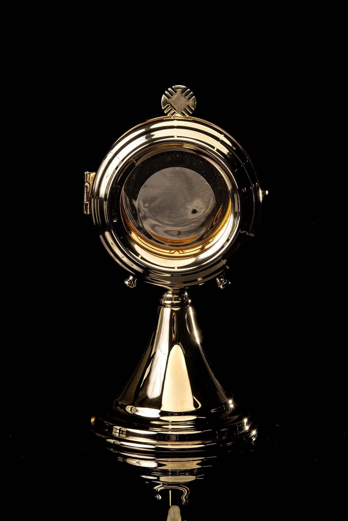Brass luna holder back view with its circular inner plate and polished rim