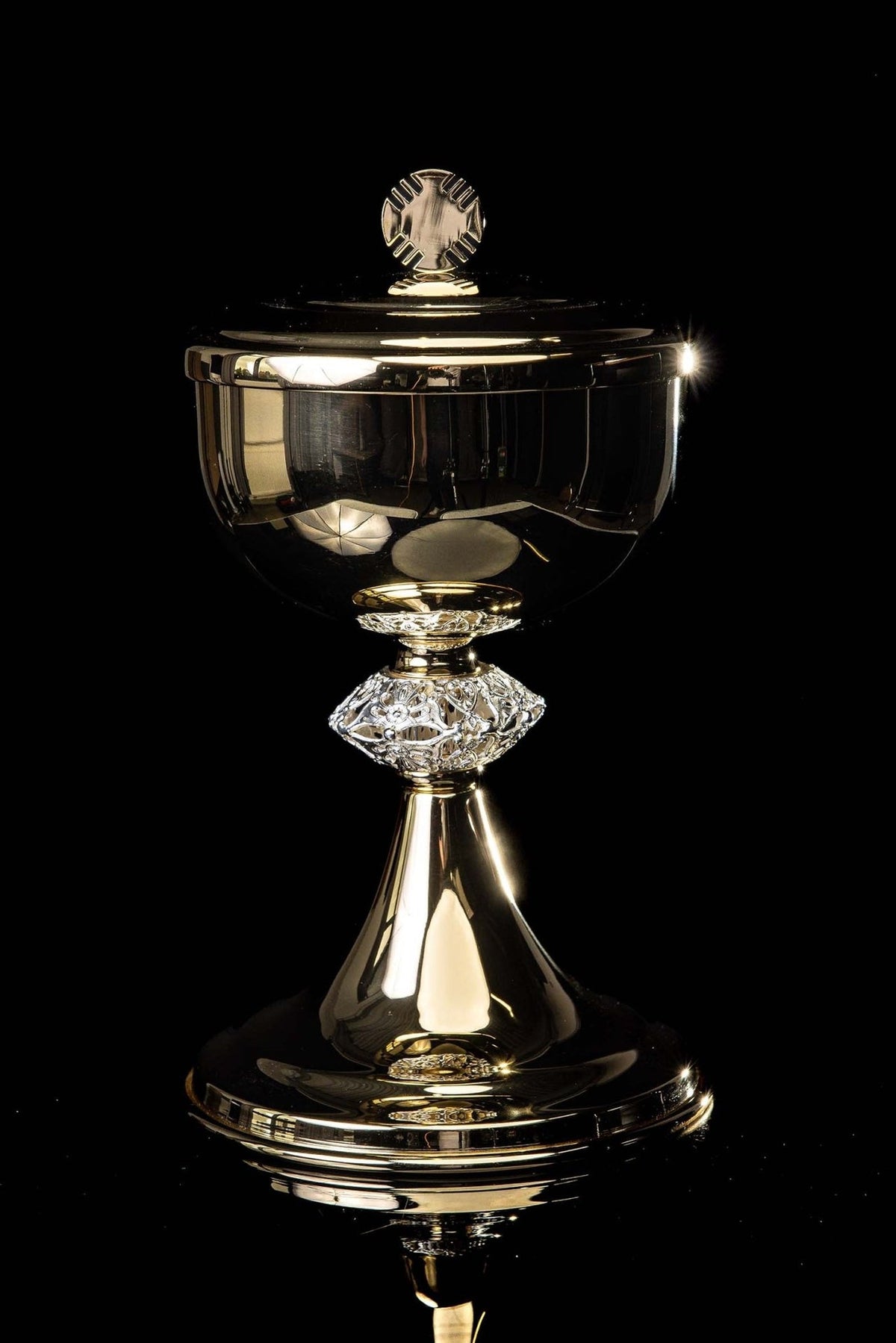 Gold-plated brass ciborium, full front view with ornate stem and cross-topped lid