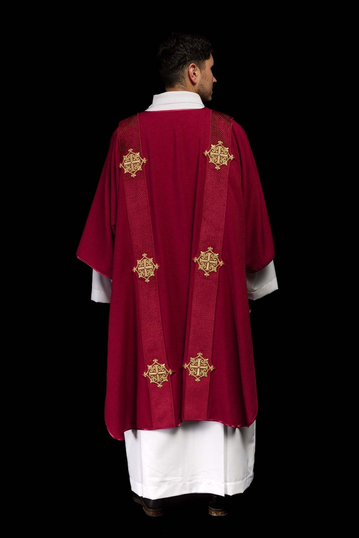 Red dalmatic back view with velvet orphreys and gold embroidered crosses