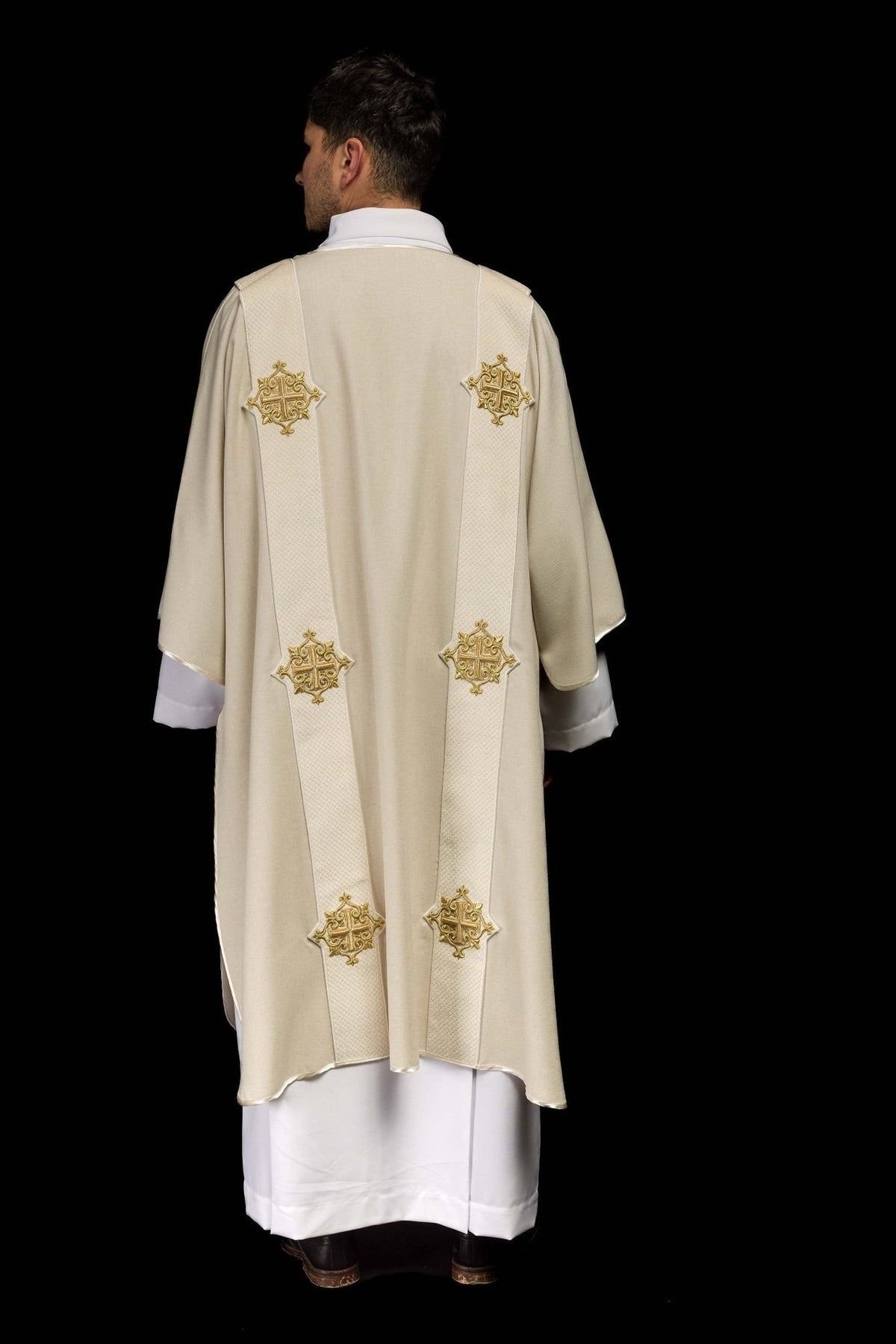 Ecru dalmatic back view with matching orphreys and gold embroidered crosses