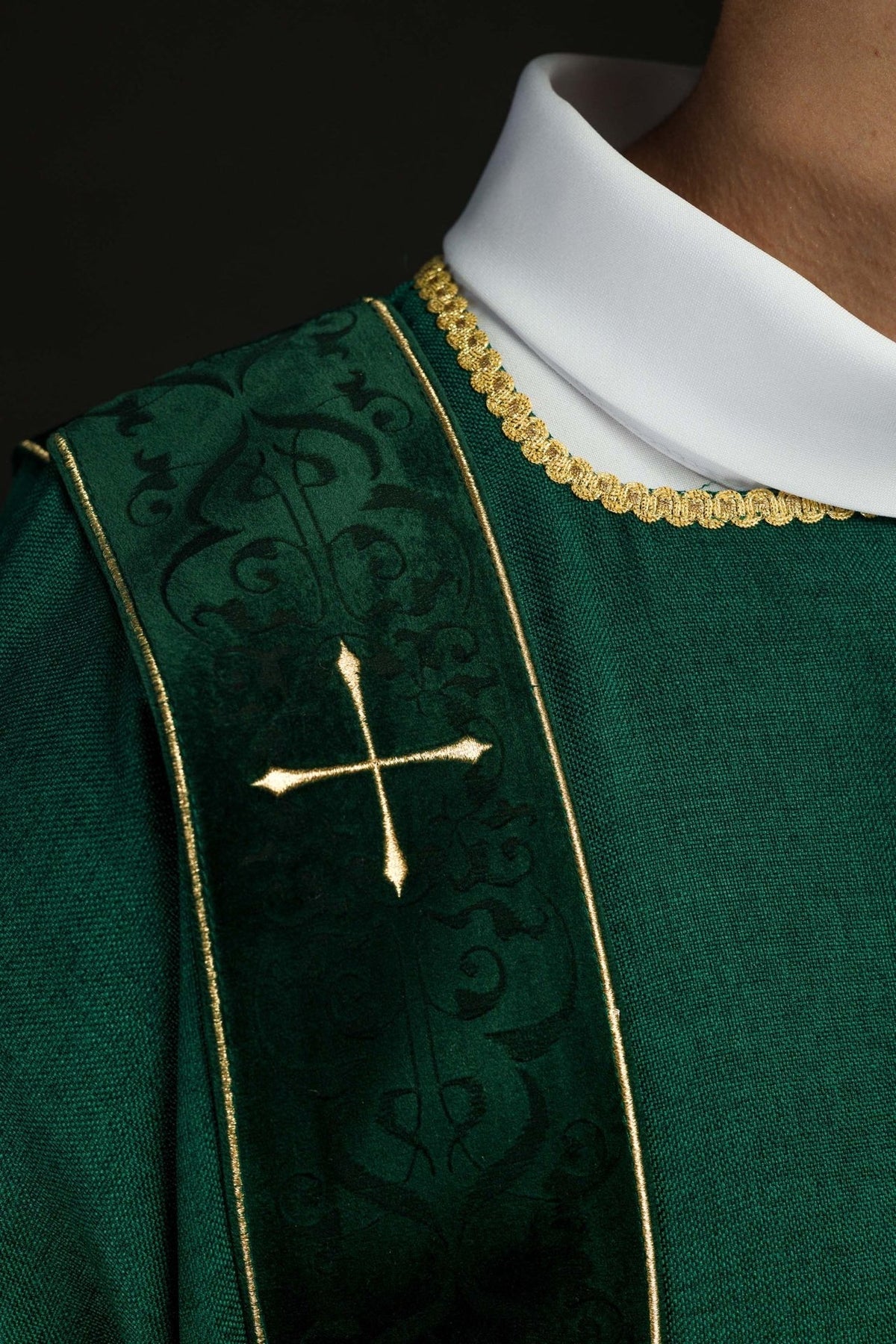 Green dalmatic close-up of velvet orphrey, gold cross and trim