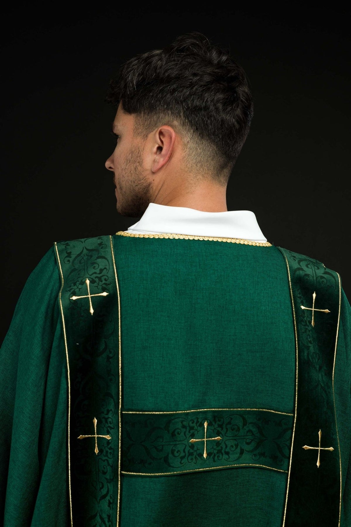 Green dalmatic back close-up with velvet orphreys and gold crosses