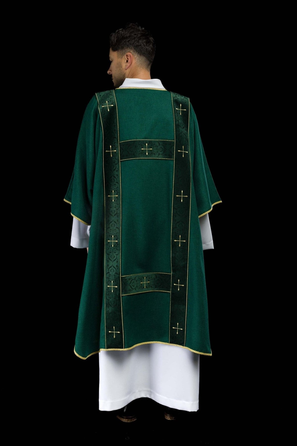 Green dalmatic back view with velvet orphreys and embroidered gold crosses