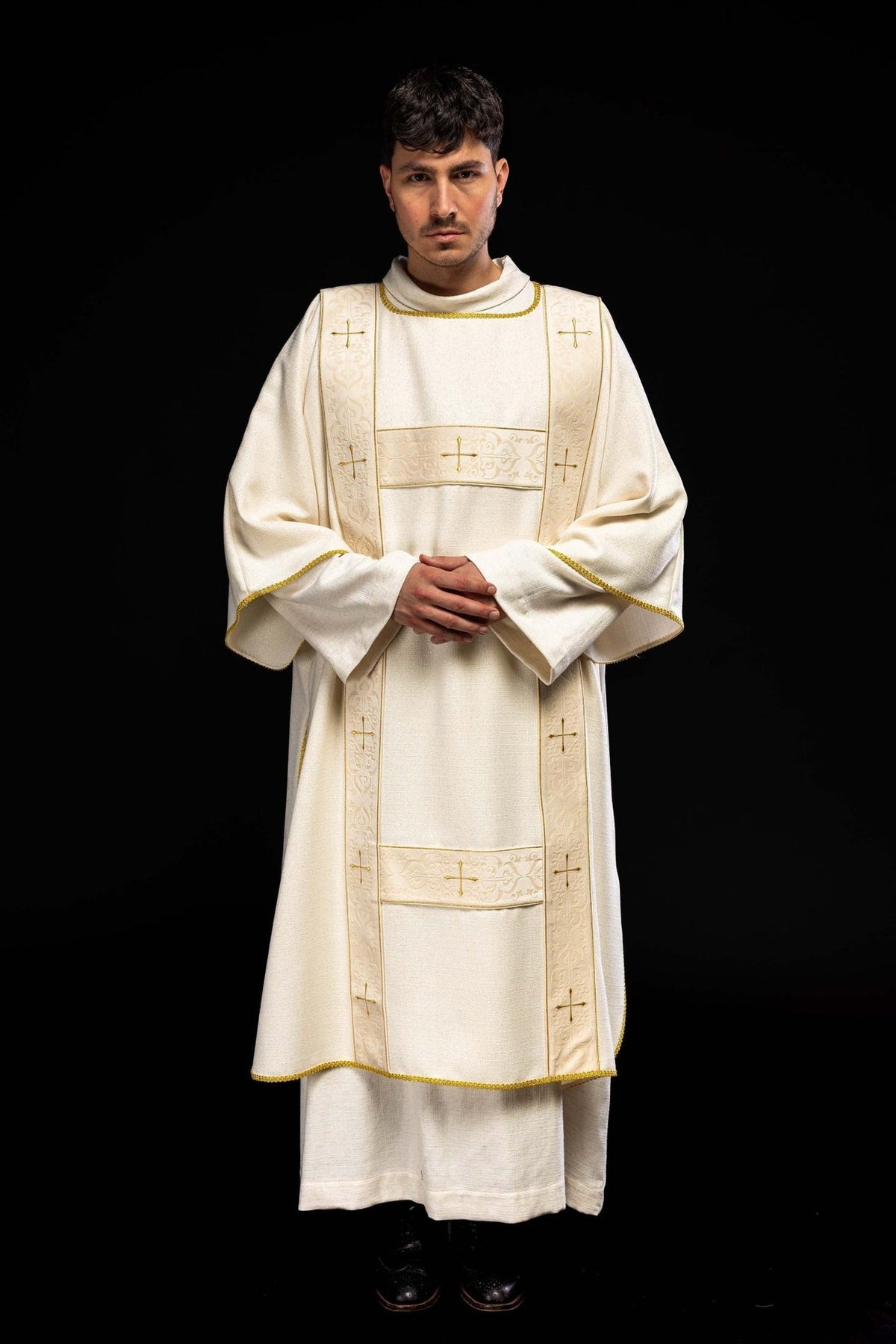 Ecru dalmatic with velvet orphreys and embroidered gold crosses, full front view