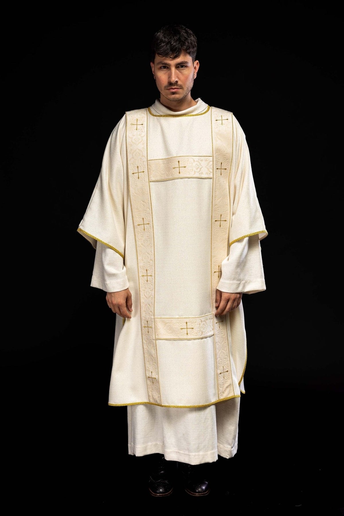 Ecru dalmatic front view with velvet orphreys and embroidered gold crosses