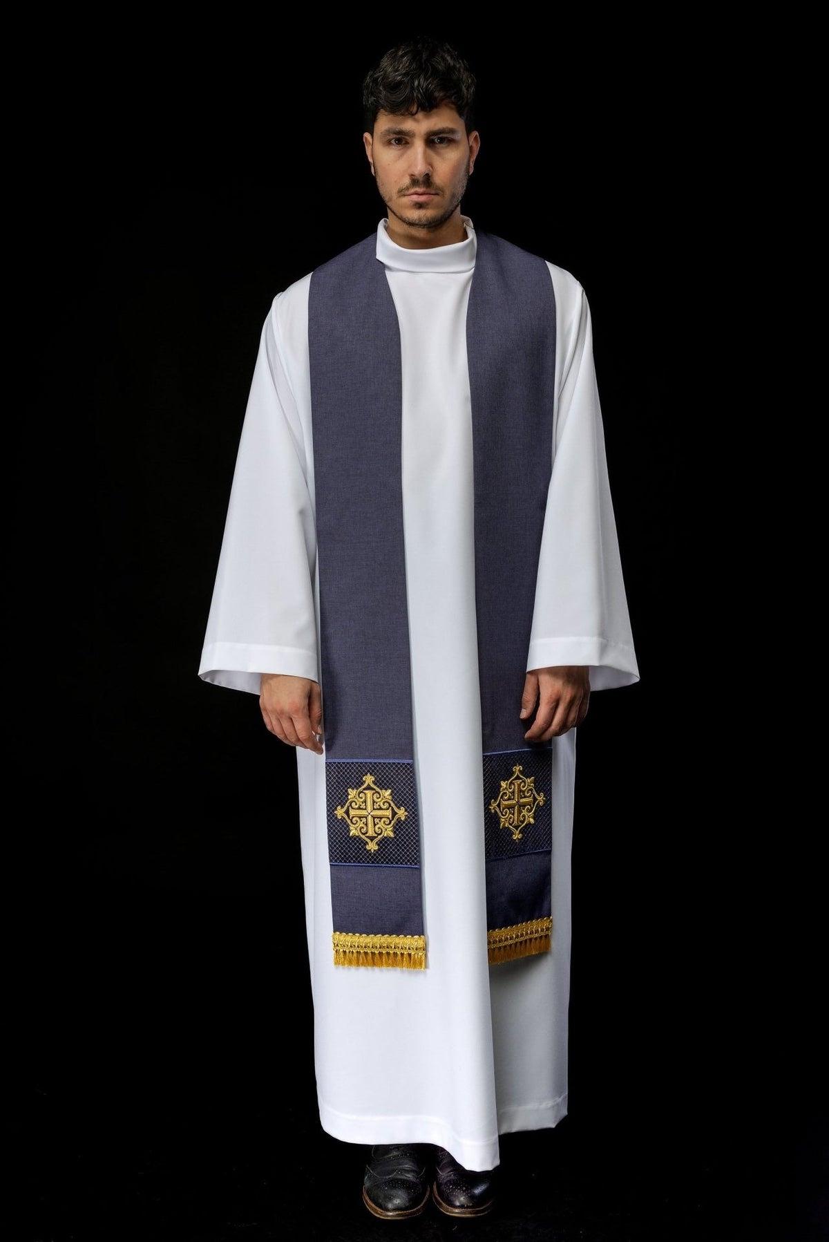 Purple velvet stole worn front view with gold cross embroidery and fringe