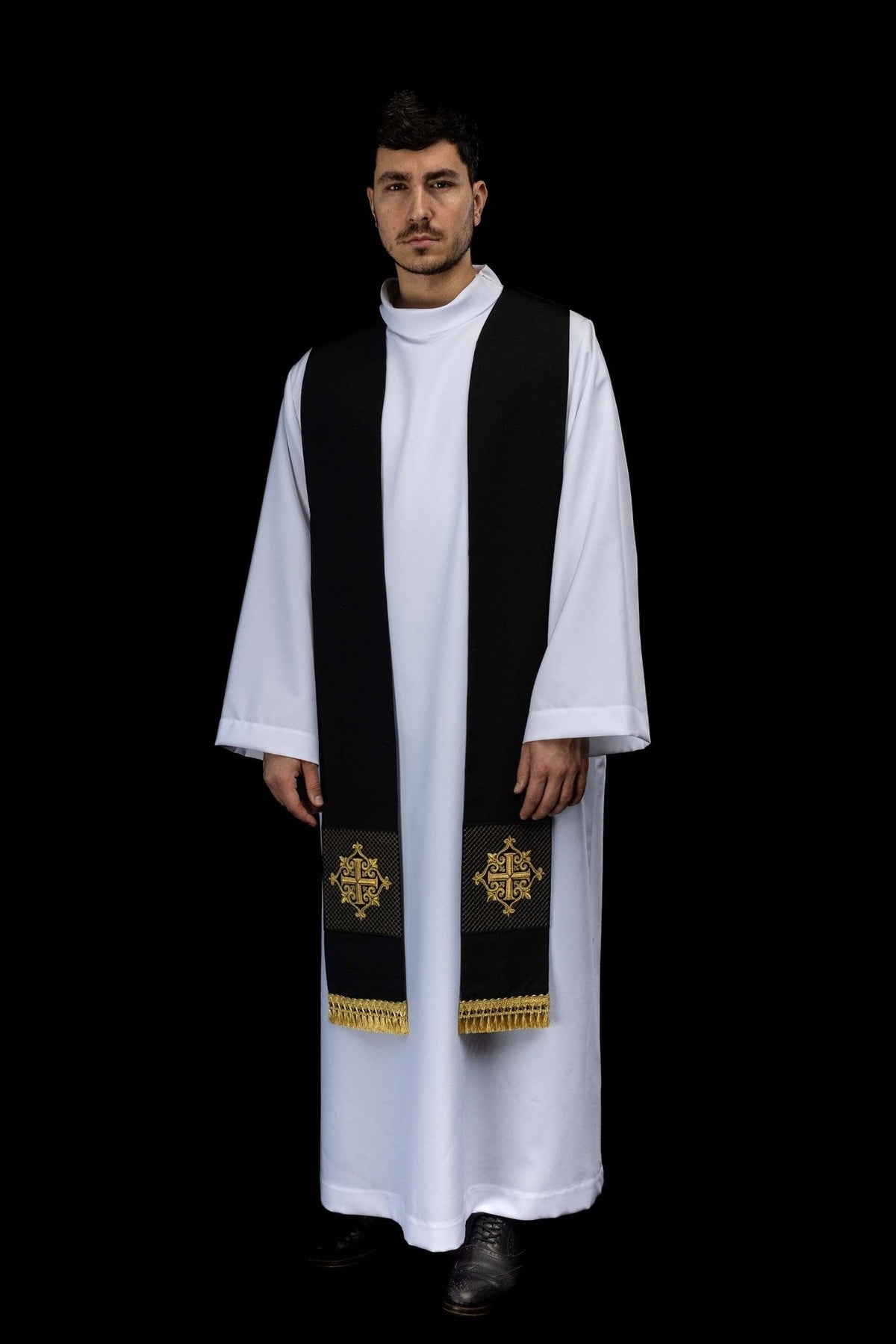 Embroidered black stole worn full front view with gold cross
