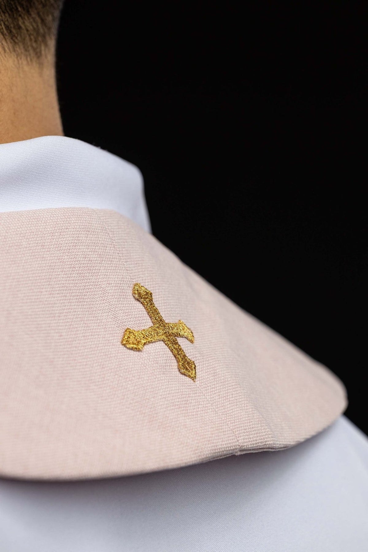 Rose velvet stole close-up with small embroidered gold cross